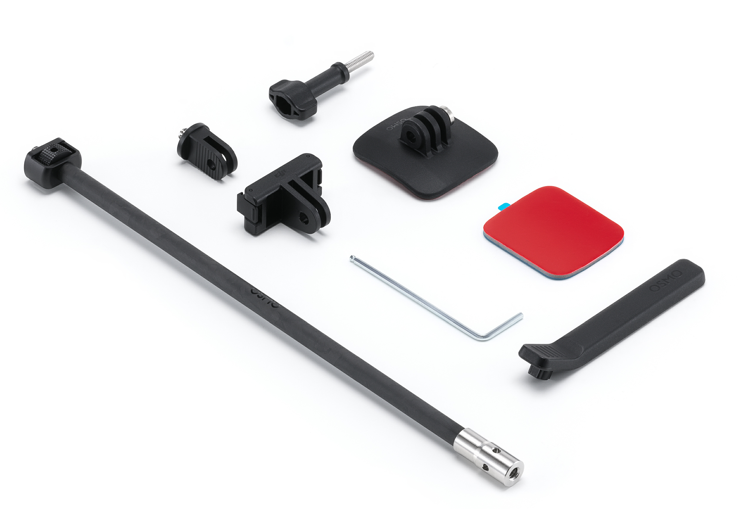 Różne czarne akcesoria do aparatu, w tym uchwyty, przedłużka i czerwono-niebieska podkładka, są ułożone na białej powierzchni.