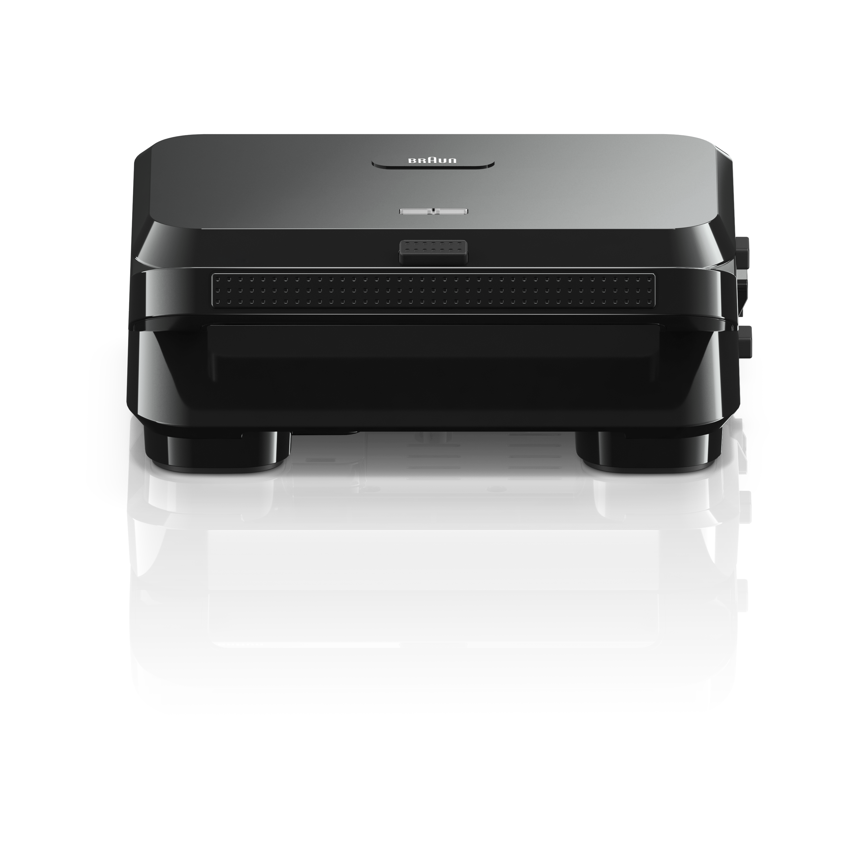 Ein schwarzes Braun-Gerät, wahrscheinlich ein Rasierer, auf schwarzem Hintergrund. Das Design ist elegant, mit mehreren Schichten.