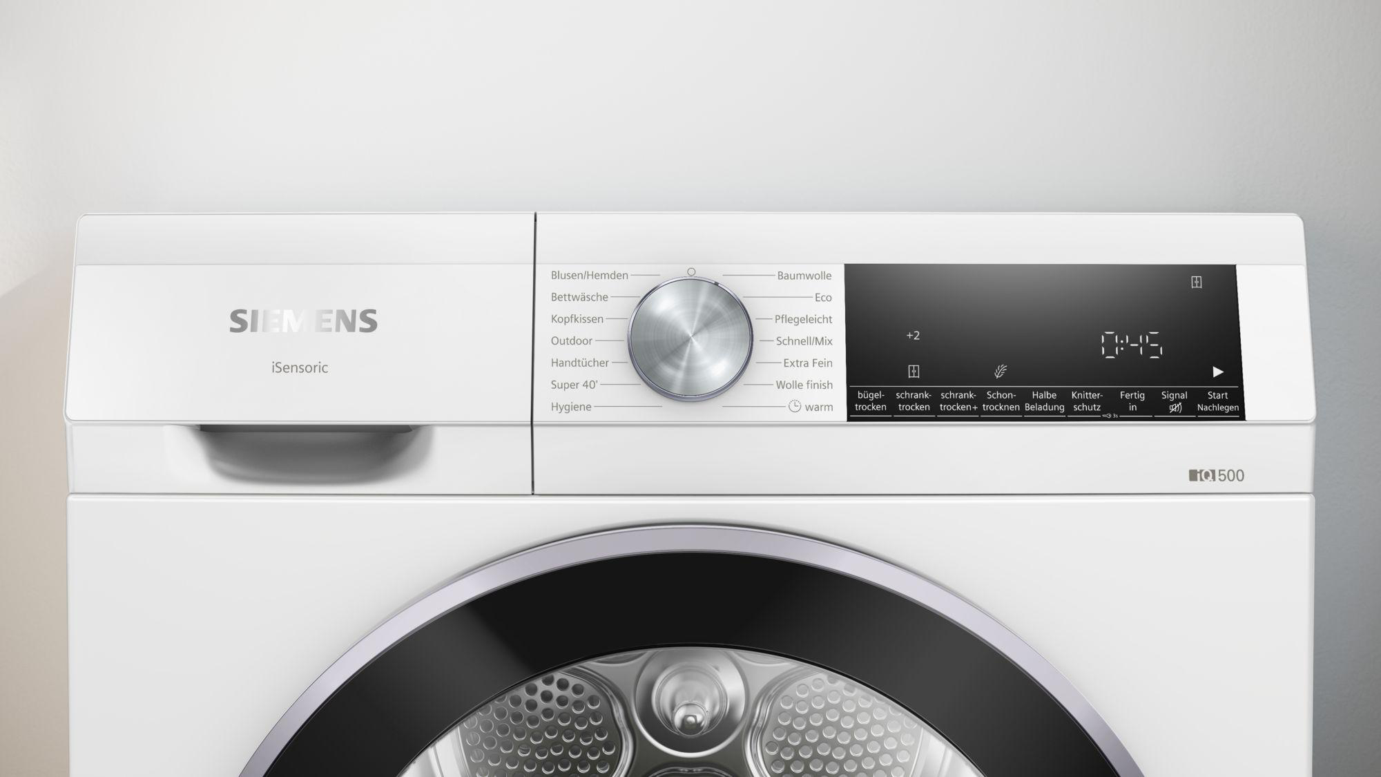 Ein weißer Siemens-Trockner. Das Bedienfeld zeigt verschiedene Trockenmodi und eine digitale Zeitanzeige.