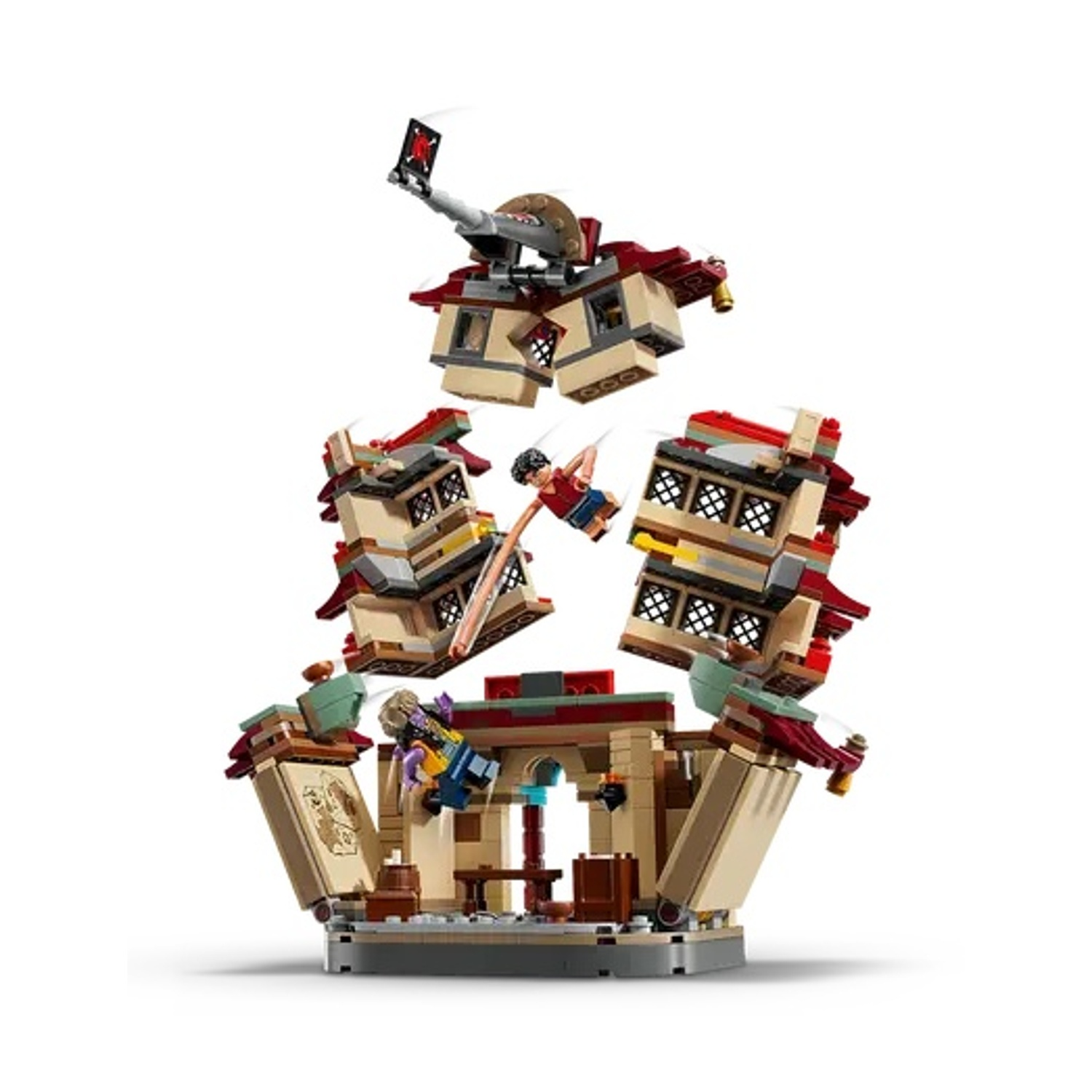 Un set LEGO che raffigura un edificio in fase di distruzione. I personaggi volano in aria. Il set include pezzi rossi, beige e grigi.