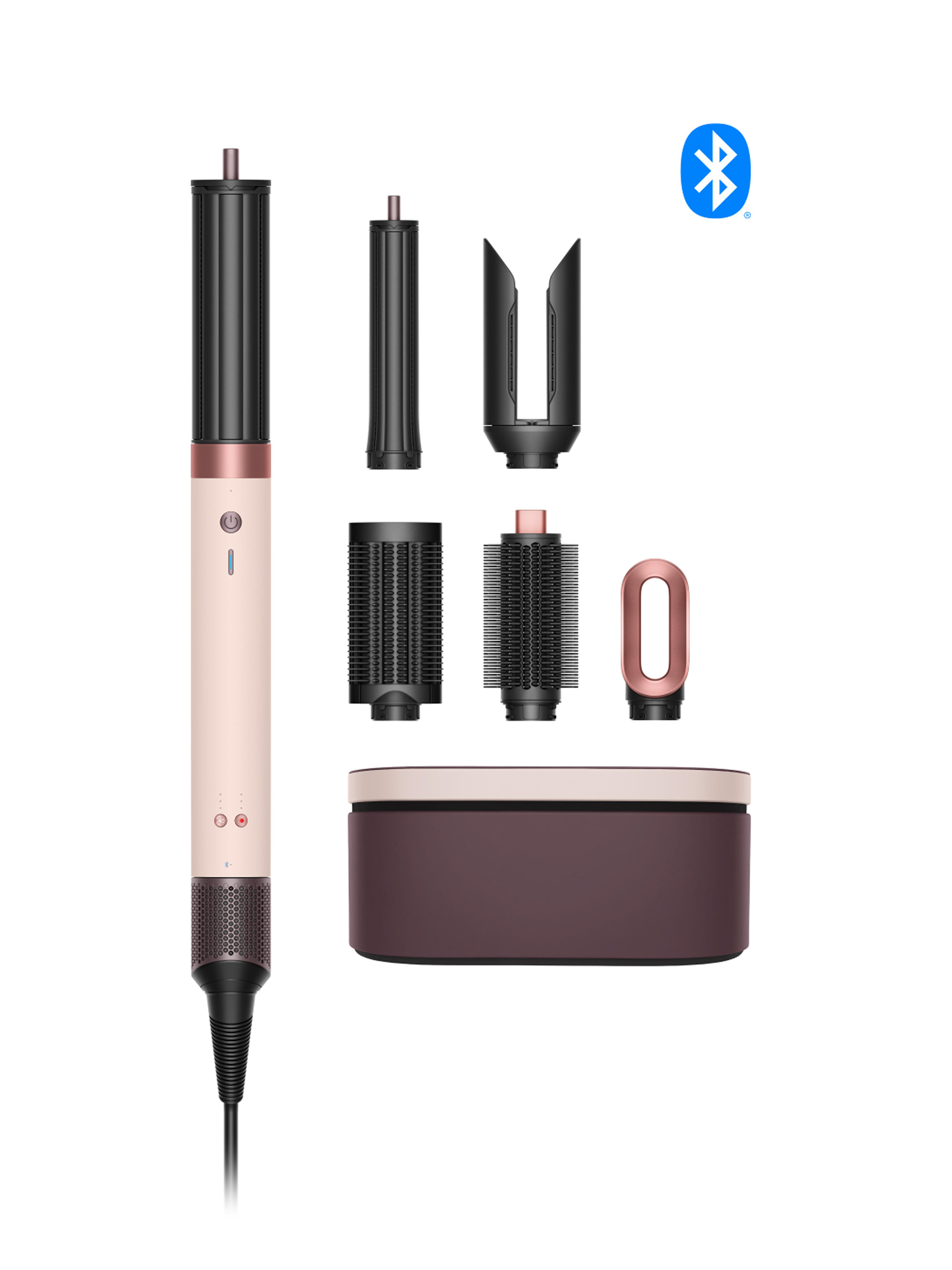 Haarstyling-Werkzeug mit Aufs&auml;tzen. Enth&auml;lt das Hauptger&auml;t, Aufs&auml;tze und einen Koffer, alles auf wei&szlig;em Hintergrund.