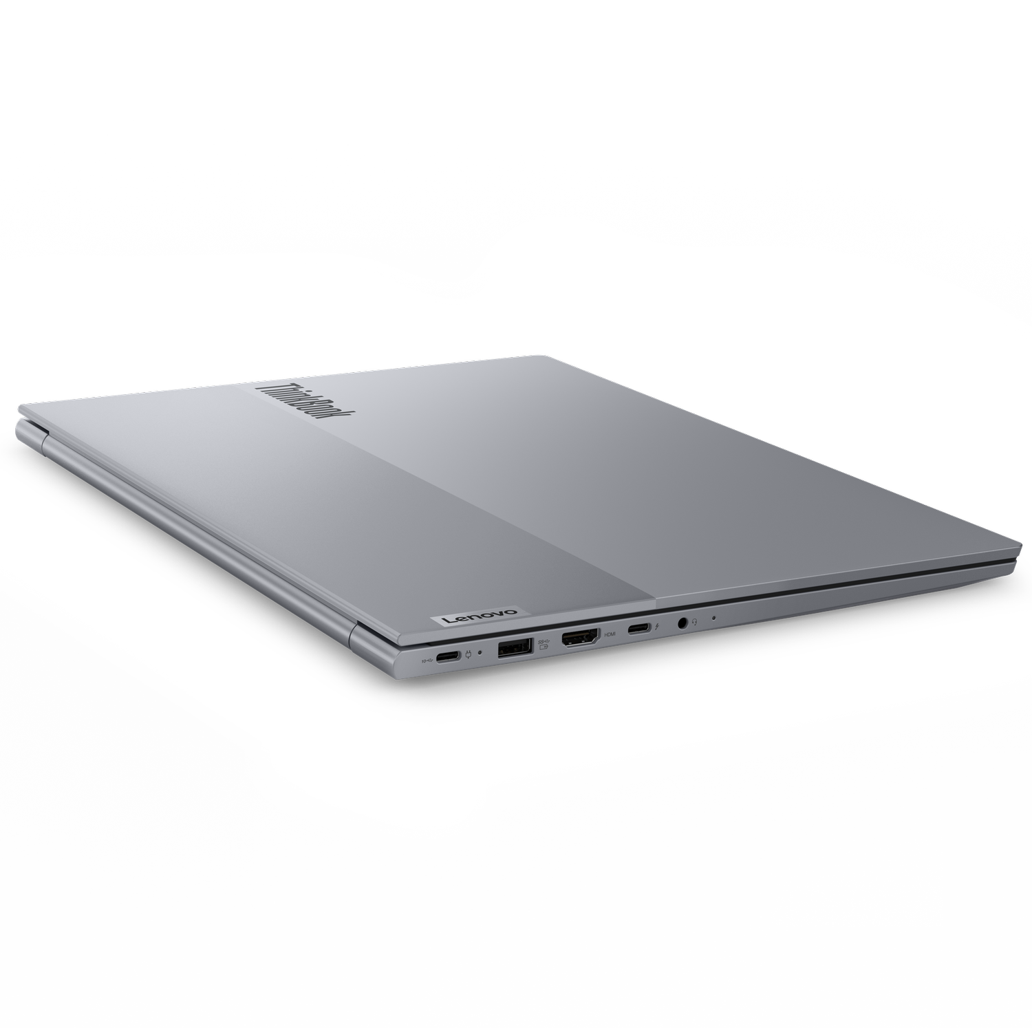 Srebrny laptop Lenovo ThinkBook jest lekko otwarty, widoczny jest wierzch. Tło jest czarne, podkreślając design laptopa.