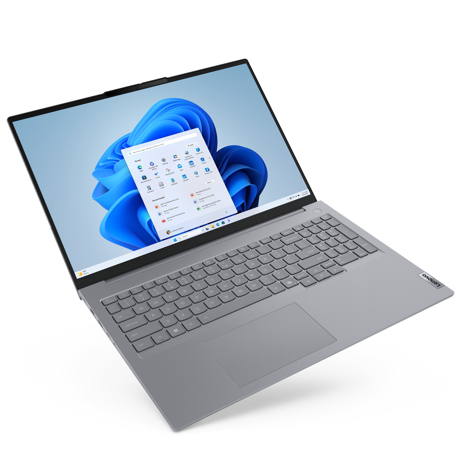 Otwarty laptop z interfejsem Windows 11. Srebrna klawiatura i gładzik. Widoczne logo Lenovo. Czarne tło.