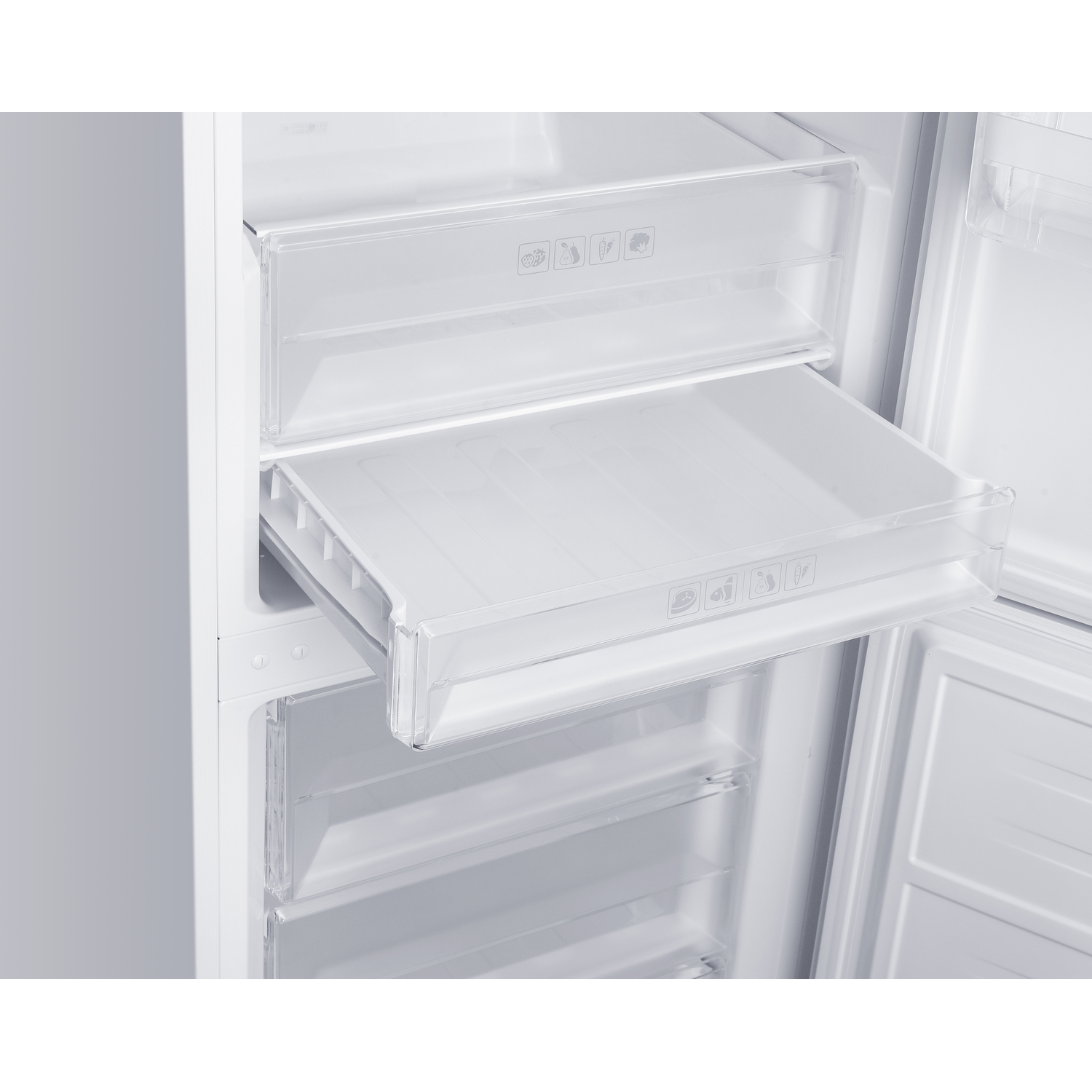 An open white refrigerator showing clear plastic drawers. The middle drawer is partially pulled out. There are icons on the drawers.