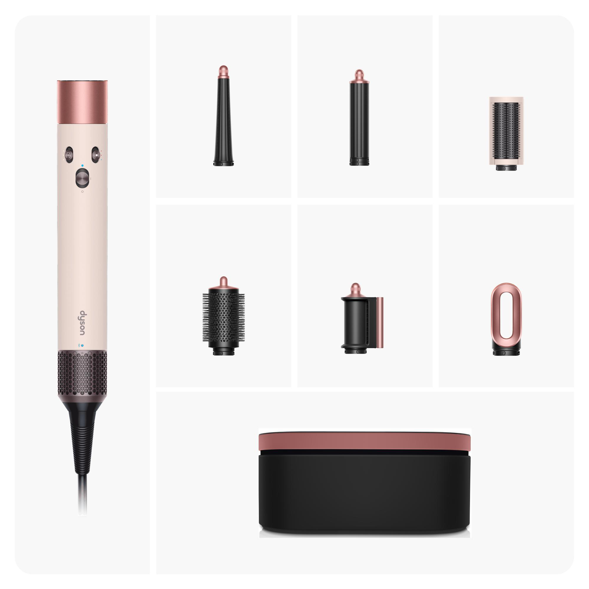 Ein Dyson Haarstyler-Set. Es enthält das Hauptgerät, mehrere Aufsätze und eine Aufbewahrungstasche. Farben: Beige, Roségold und Schwarz.