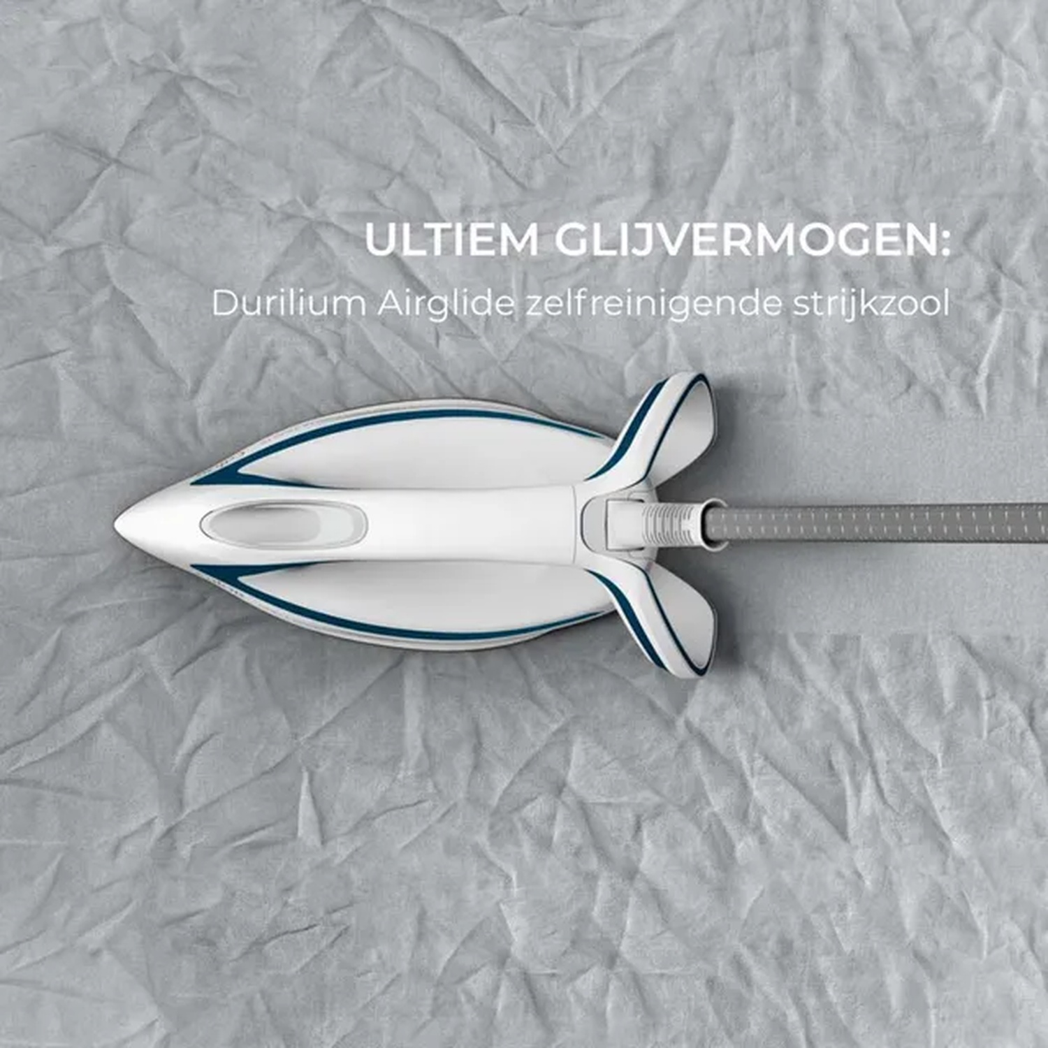 A white and blue iron on a gray textured surface. Text reads 'ULTIEM GLIJVERMOGEN: Durilium Airglide self-cleaning soleplate'.