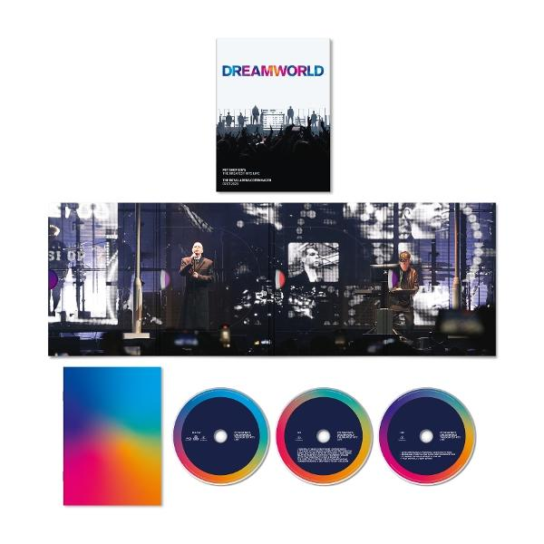 Dreamworld koncert DVD készlet. Tartalmaz egy könyvet, három lemezt és egy színes betétet. Színpad előadókkal és képernyőkkel a háttérben.