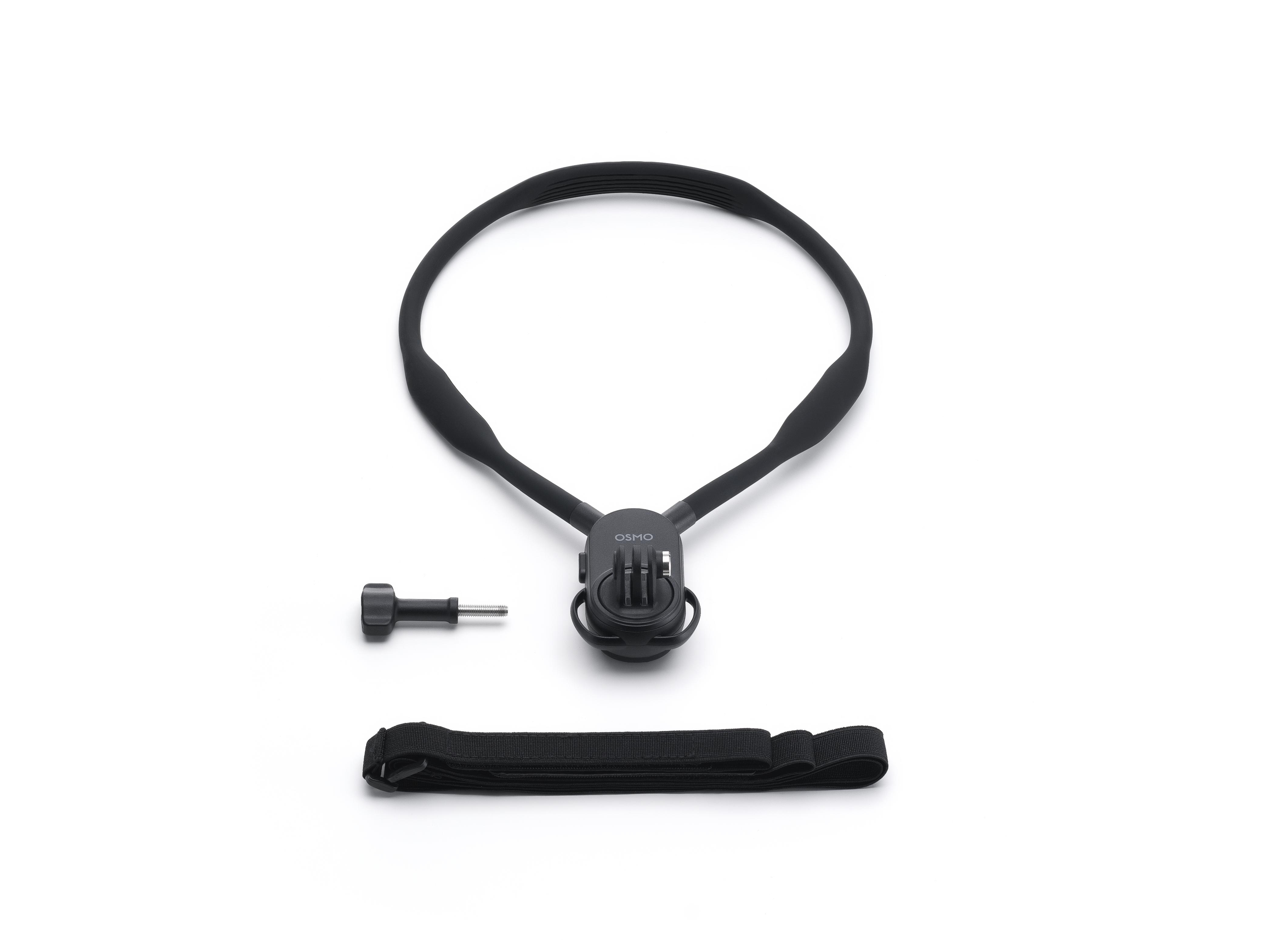 Ein schwarzes Osmo-Halsband, eine Schraube und ein Riemen liegen auf einer weißen Oberfläche.