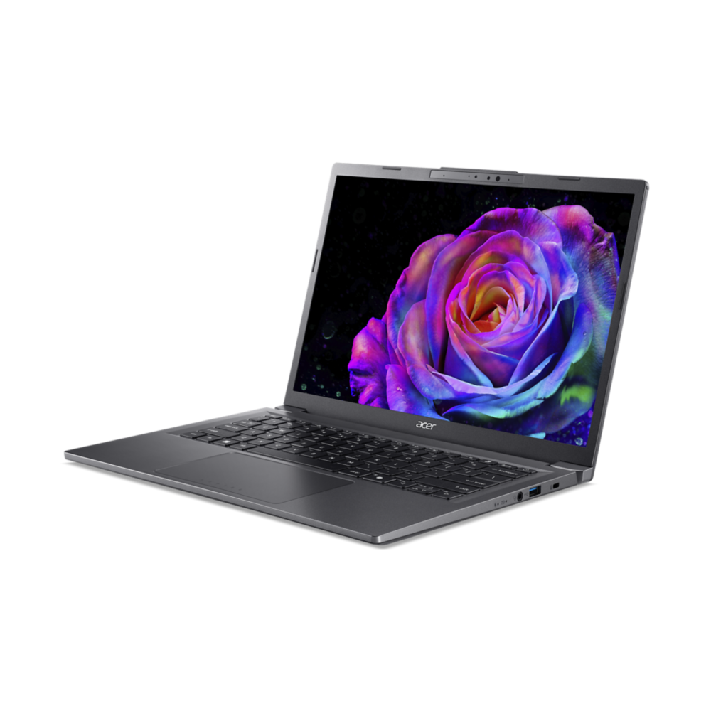 Un portátil Acer gris está abierto, mostrando una rosa colorida. El fondo es negro. El portátil está sobre una superficie blanca.