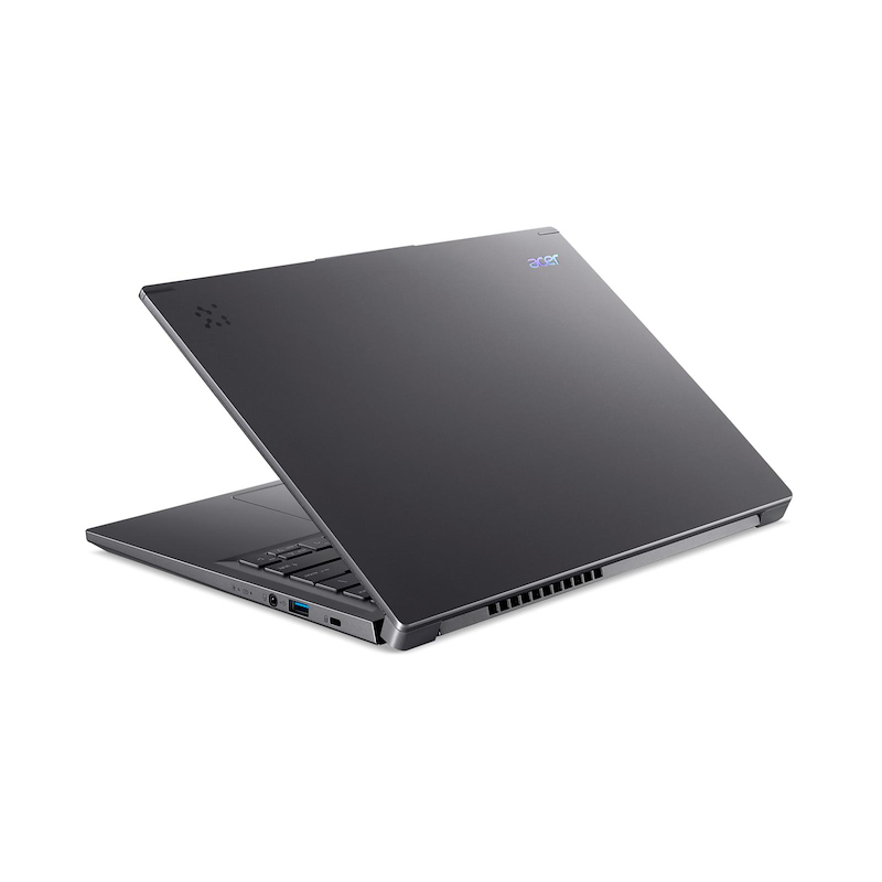 Un portátil Acer gris oscuro está ligeramente abierto sobre una superficie blanca. La pantalla está inclinada hacia arriba.