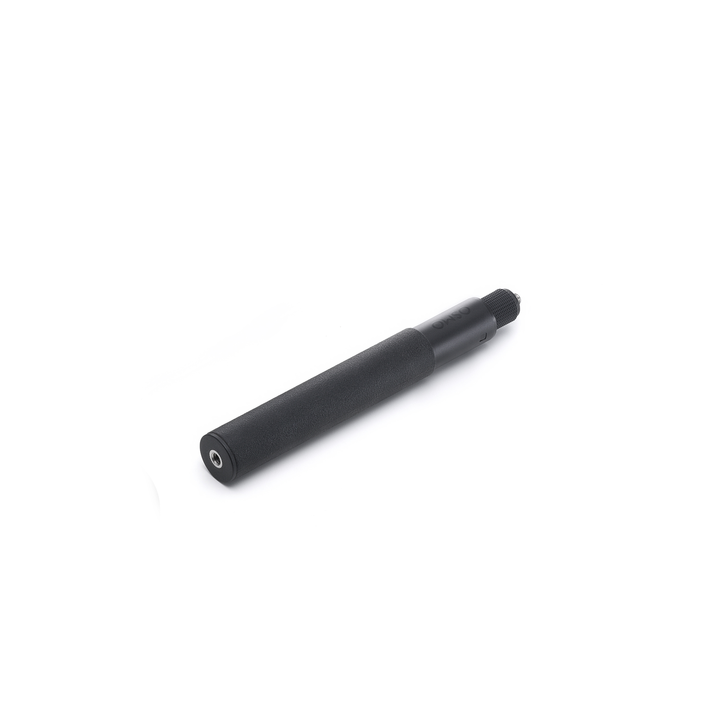 A black, cylindrical device lies diagonally on a white surface. It has a textured grip and a threaded end.
