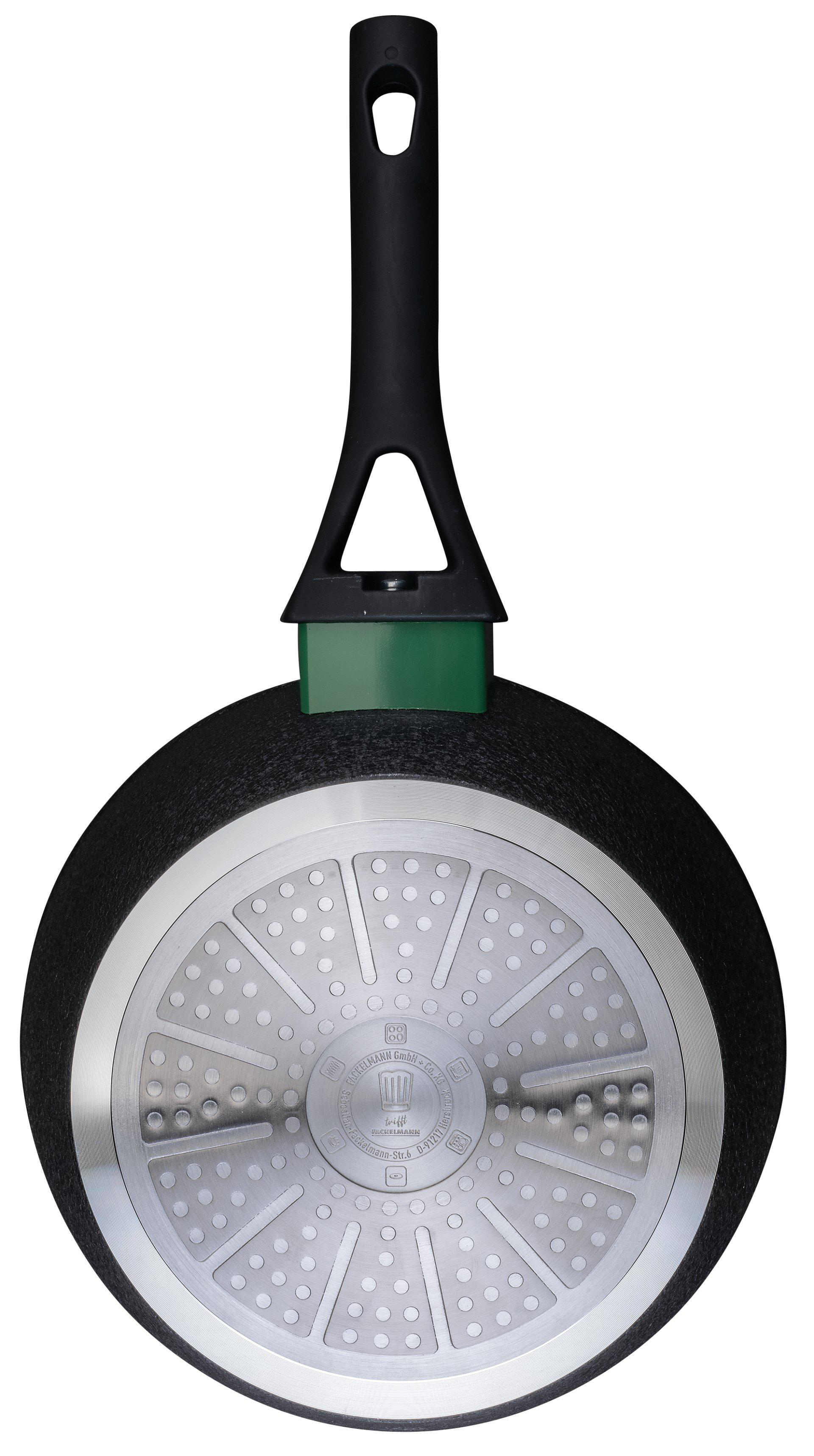 Eine schwarze Bratpfanne mit schwarzem Griff und grünem Sockel. Der Boden hat ein silbernes, gemustertes Design.