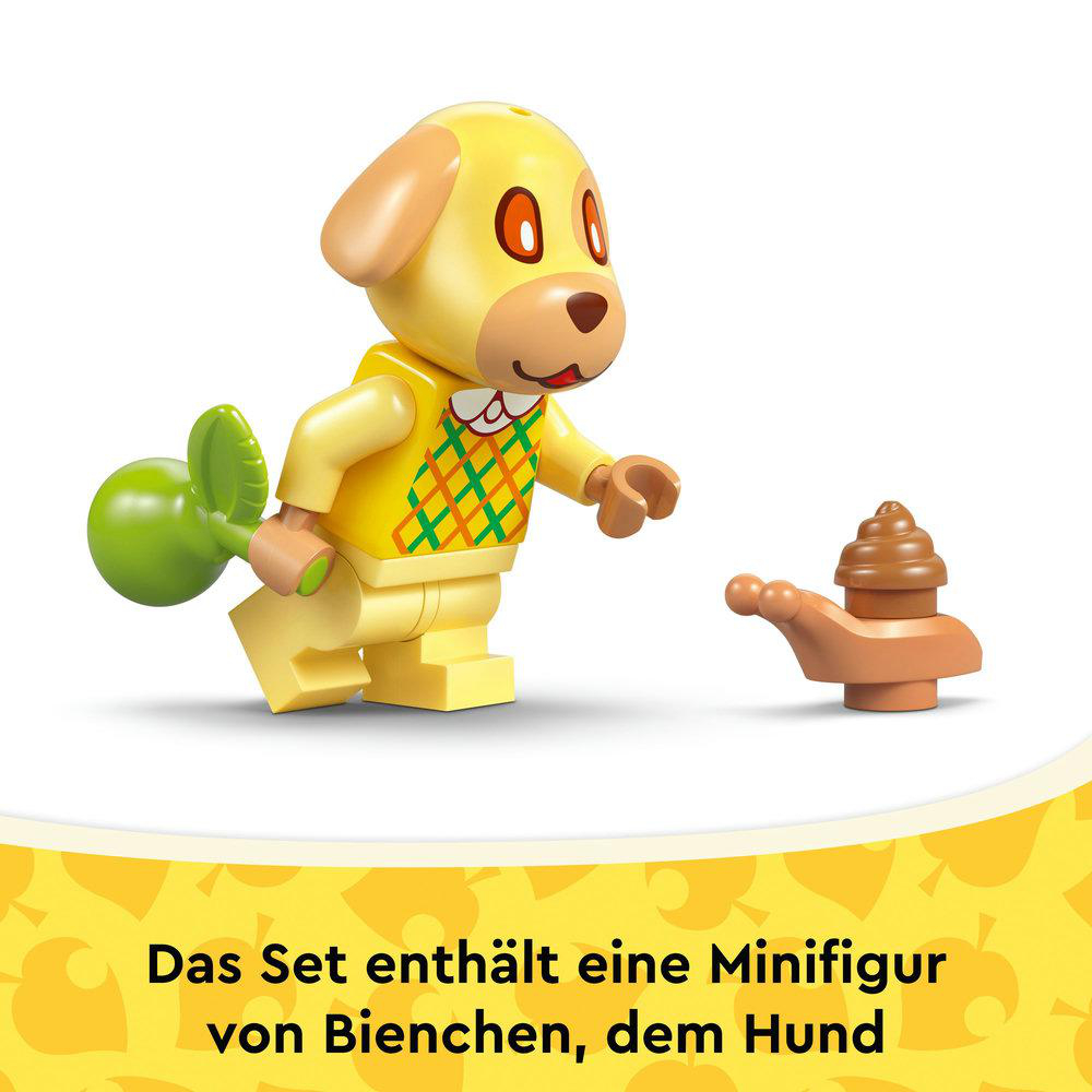 Eine gelbe Hundefigur mit einem grünen Objekt und einem braunen Kack-Emoji. Der Hund trägt ein gelbes Hemd mit grünem und gelbem Muster.