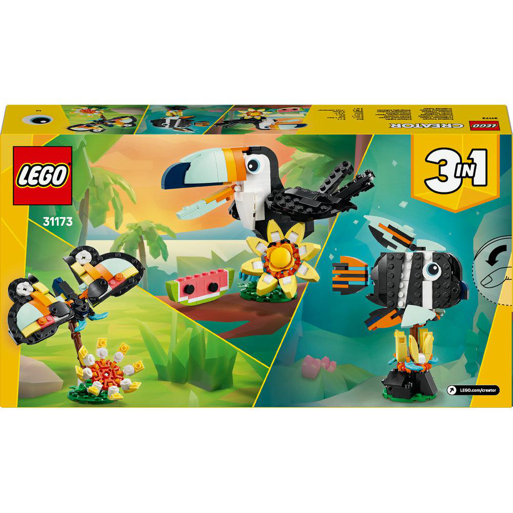 Eine Lego-Box mit einem Tukan, einem Fisch und einer Blume. Die Box ist gelb und grün. Das Lego-Logo befindet sich oben links.