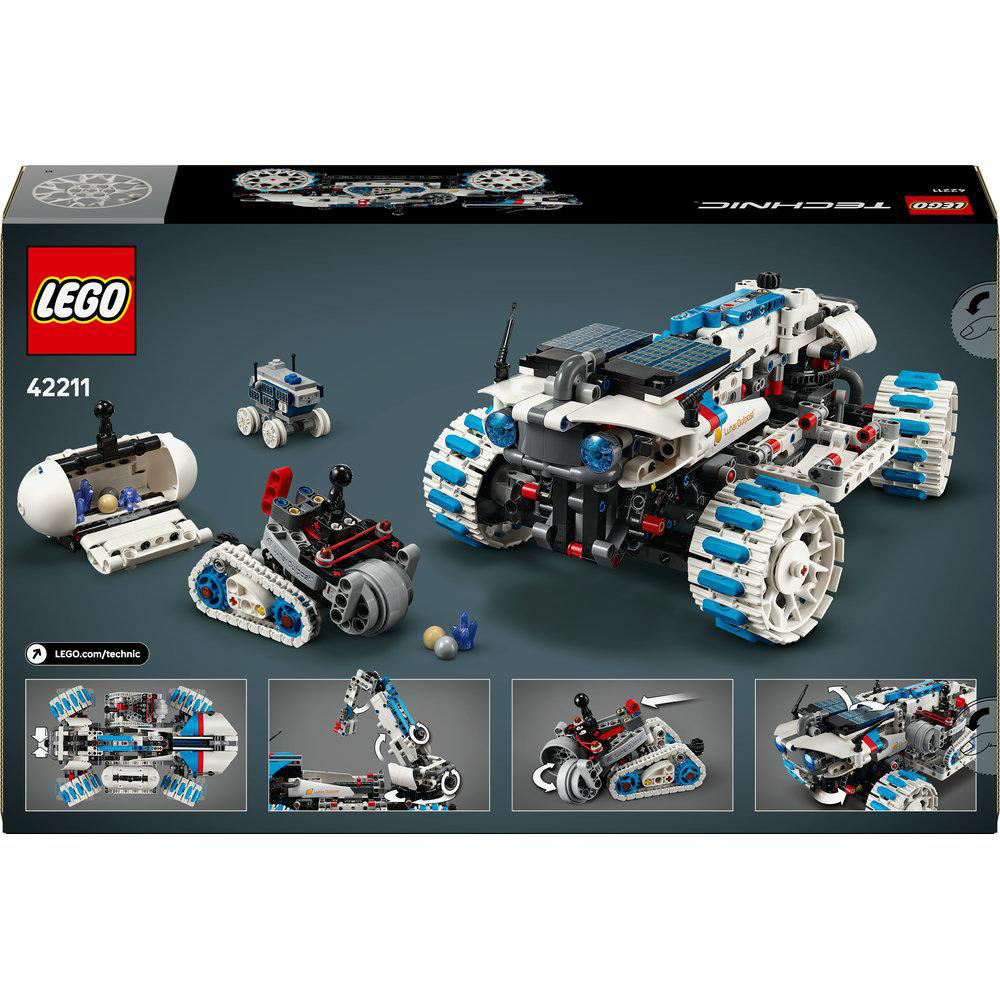 LEGO Technic Set mit großem weiß-blauem Rover, kleineren Fahrzeugen und einer geöffneten Kapsel vor grauem Hintergrund.