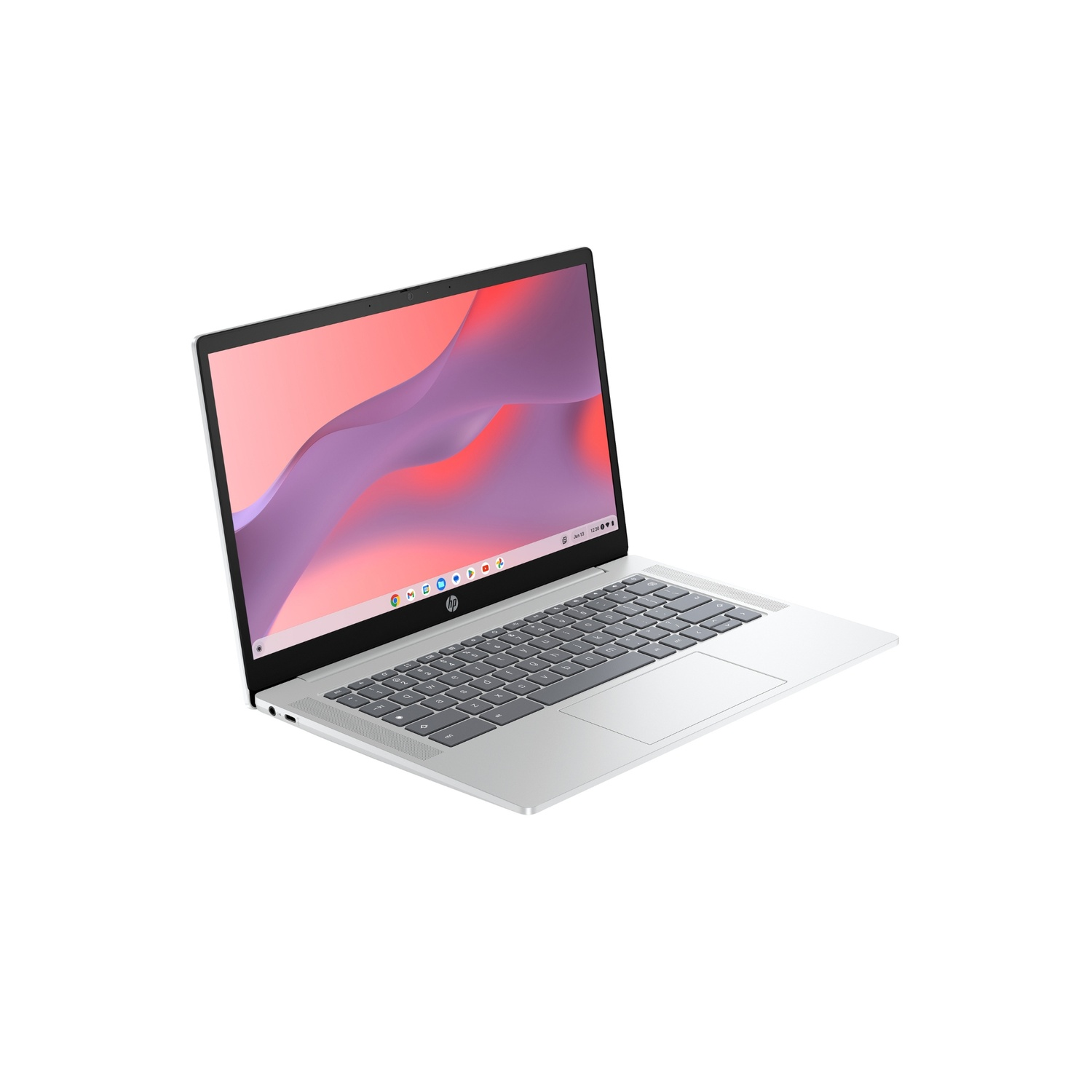 A silver HP laptop is open, displaying a pink and purple abstract background. The keyboard is visible, and the screen is angled.
