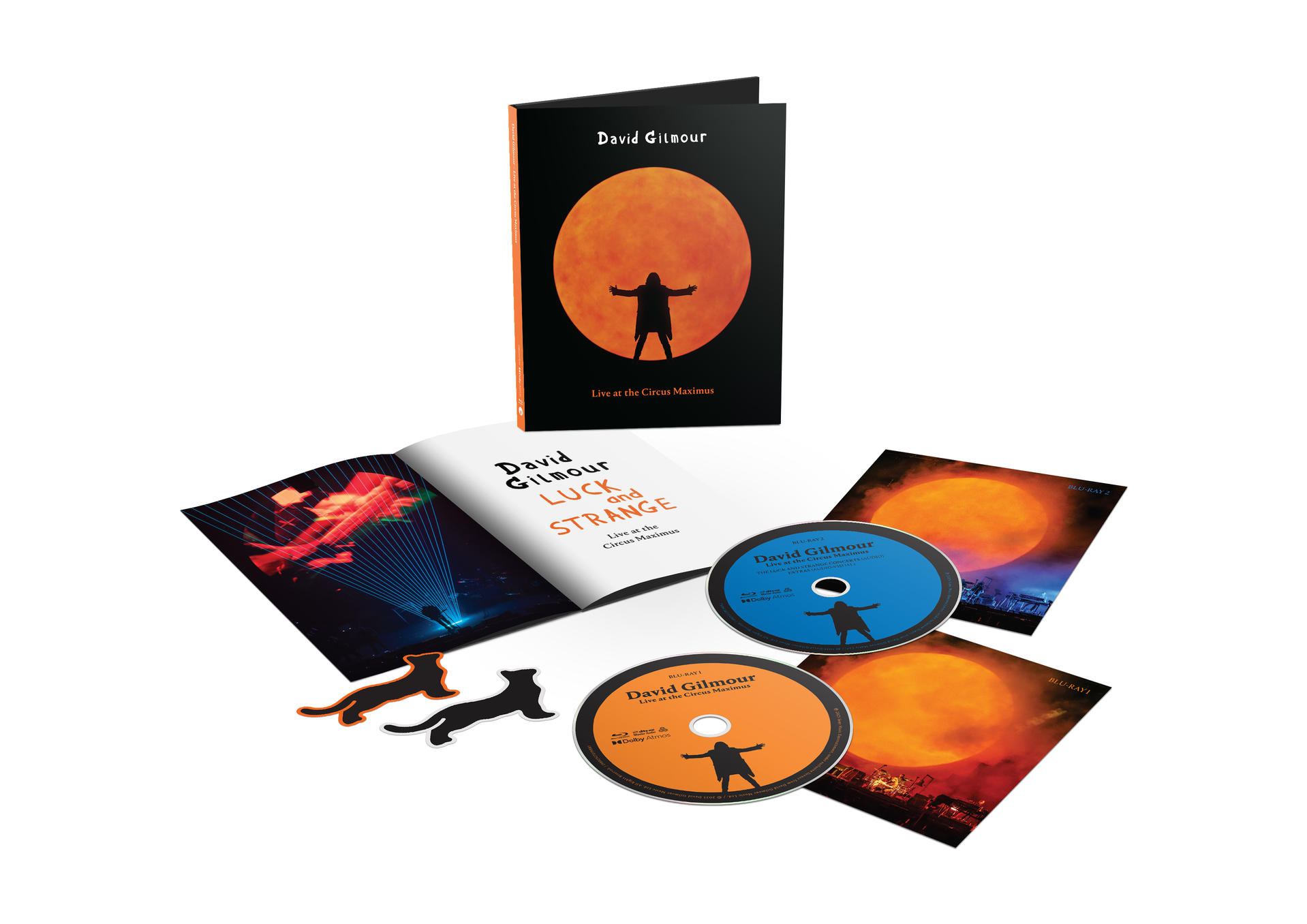David Gilmour 'Luck and Strange' albumcsomagja. Blu-ray lemezeket, egy füzetet és matricákat tartalmaz, mindegyik narancssárga és fekete dizájnnal.