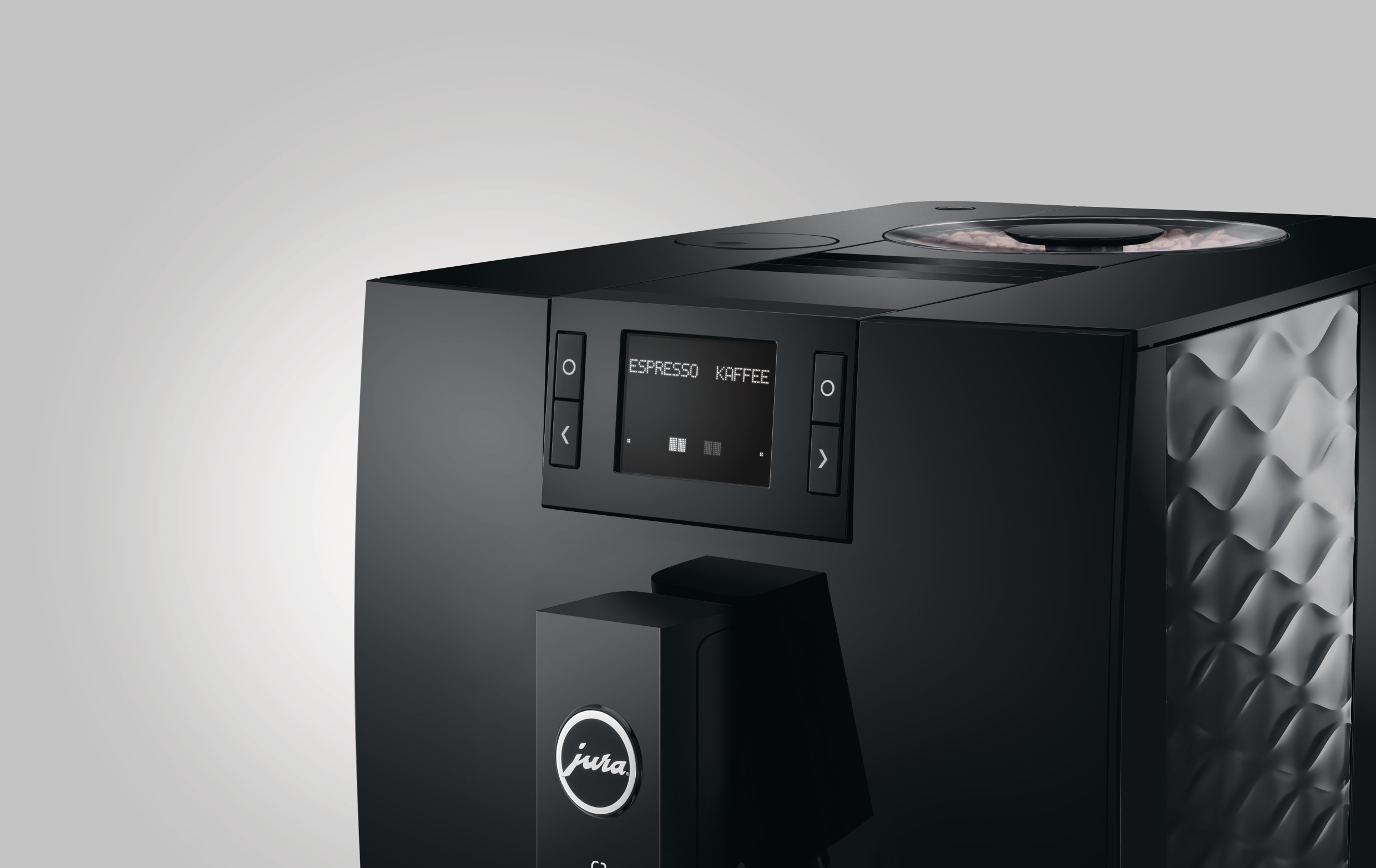 Eine schwarze Jura-Kaffeemaschine. Sie hat ein Display mit Espresso und Kaffee. Sie hat eine strukturierte Seitenwand.