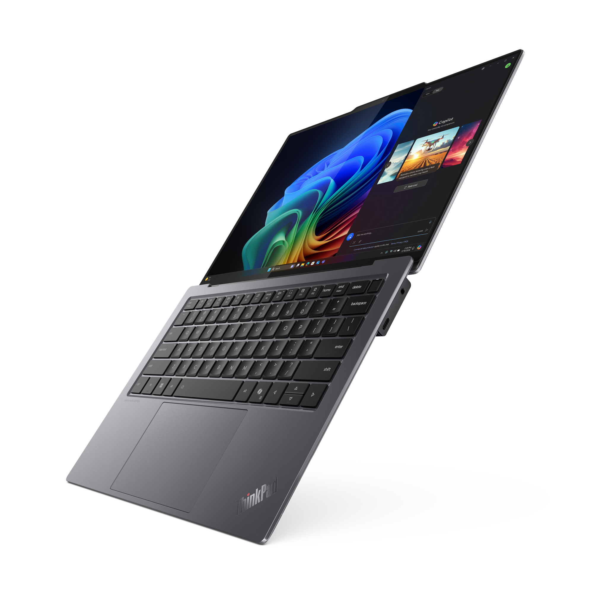 Ein grauer Lenovo ThinkPad-Laptop ist geöffnet und zeigt einen farbenfrohen Bildschirm. Die Tastatur steht im Fokus, vor schwarzem Hintergrund.