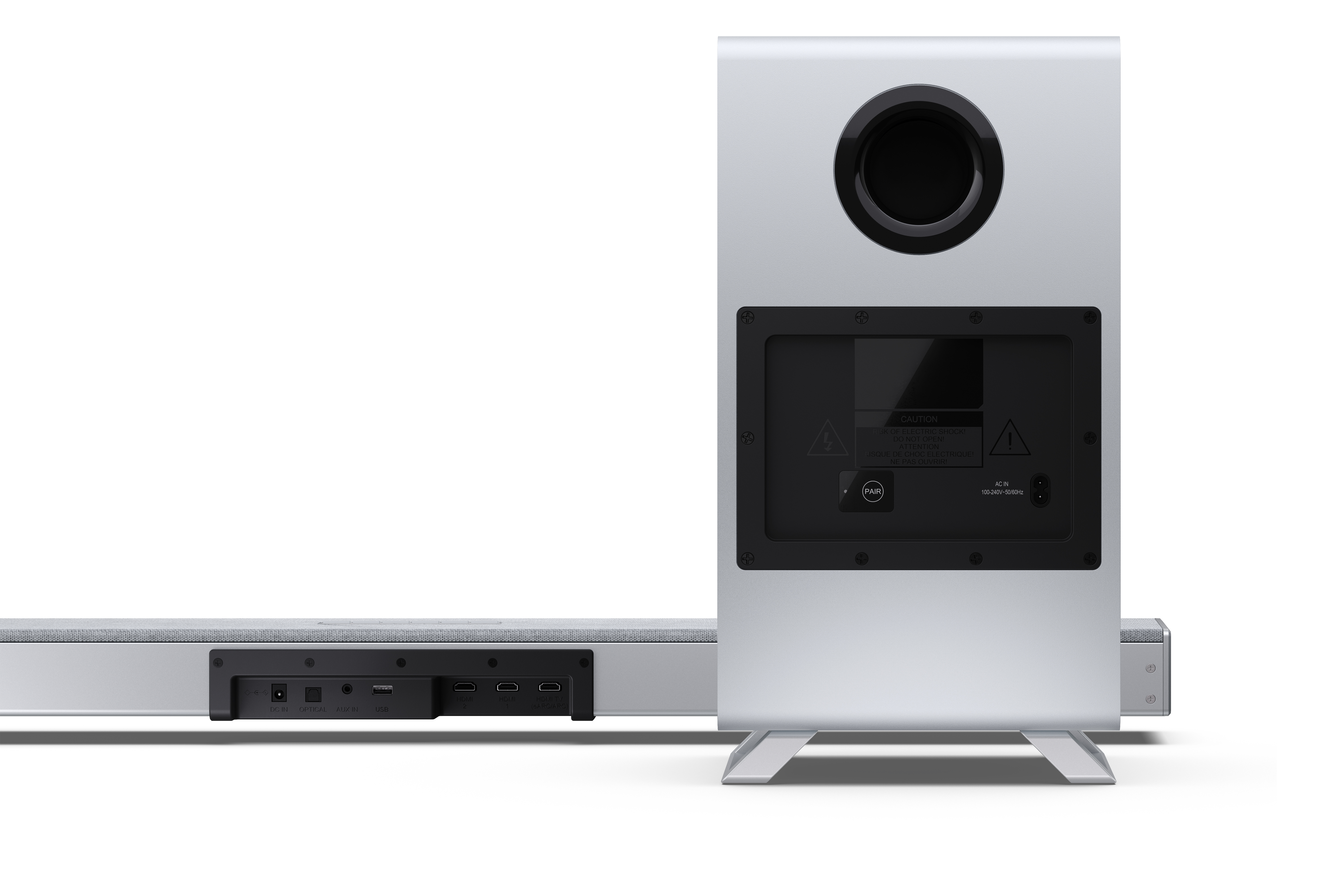 Srebrny soundbar i subwoofer. Subwoofer ma duży, czarny, okrągły otwór. Soundbar pokazuje porty dla różnych połączeń.