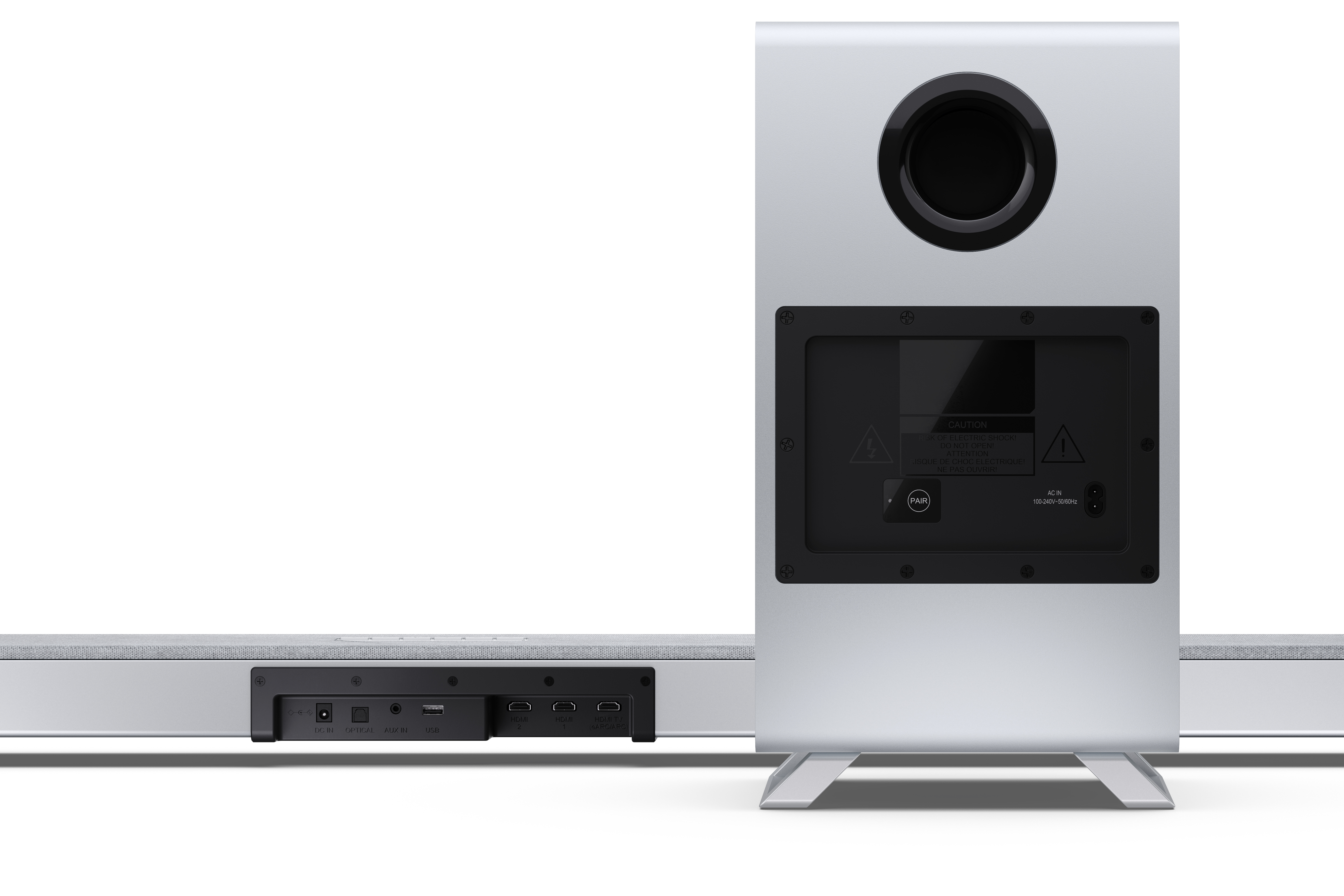 Srebrny soundbar z subwooferem. Z tyłu czarny panel z ostrzeżeniami i wejściem zasilania.