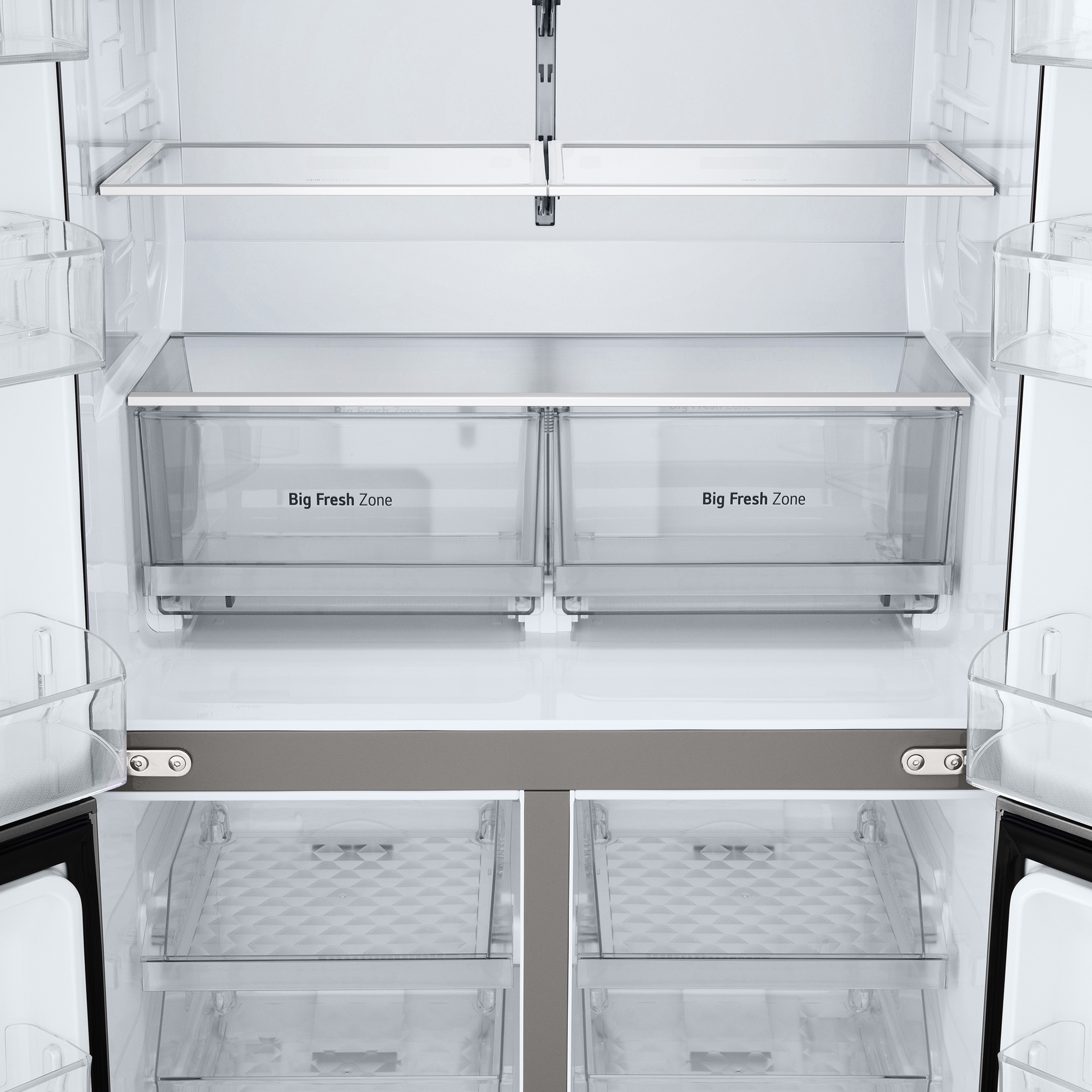 Interior de un refrigerador. Dos cajones etiquetados 'Big Fresh Zone'. Hay estantes y cajones de plástico transparente.