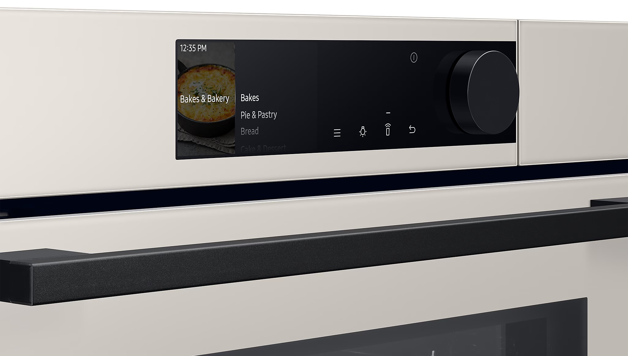 Panel sterowania piekarnika z opcją 'Bakes & Bakery'. Ma pokrętło i czarny uchwyt. Godzina to 12:35.