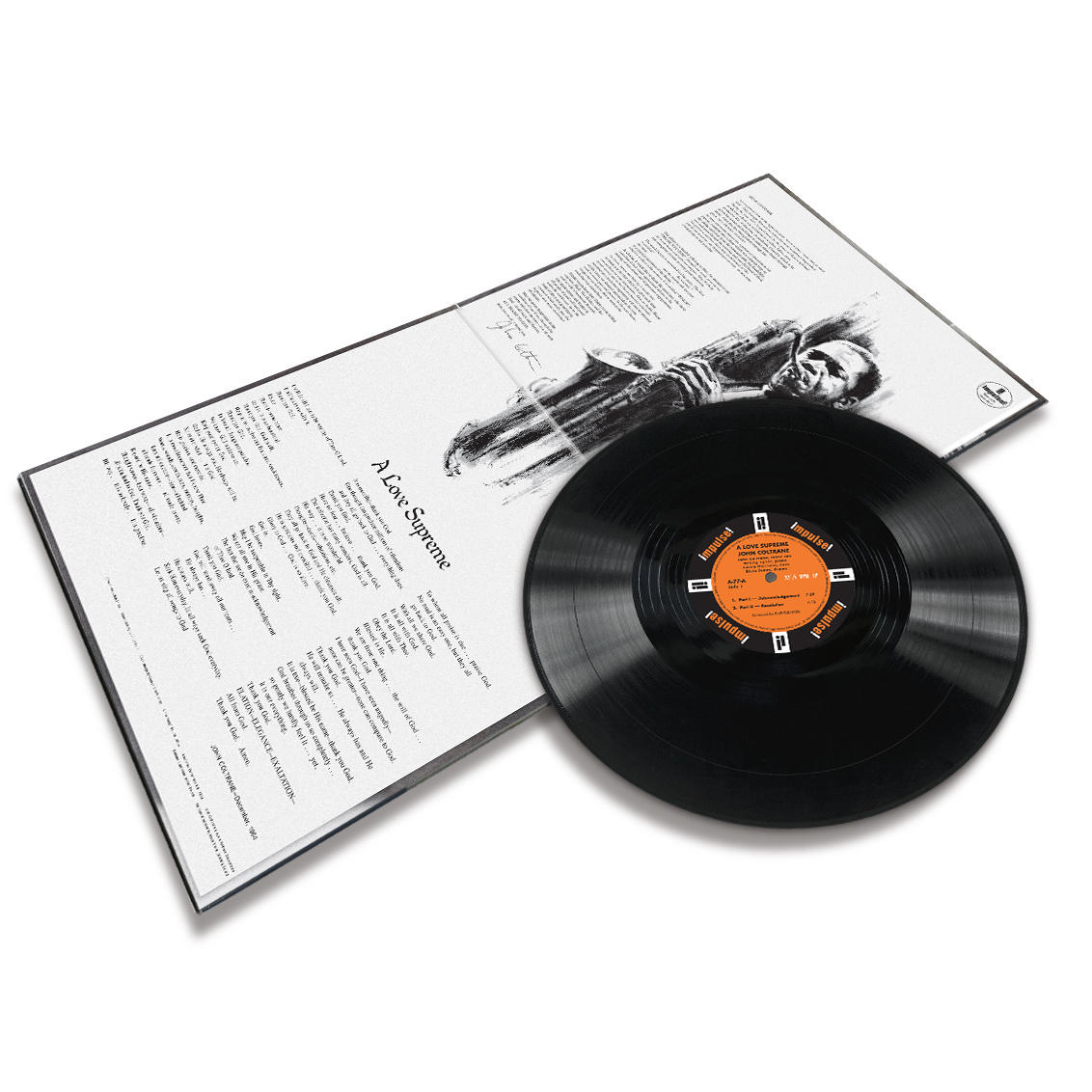 Eine Schallplatte und ein Albumcover liegen auf einer weißen Oberfläche. Das Album trägt den Titel 'A Love Supreme' von John Coltrane.