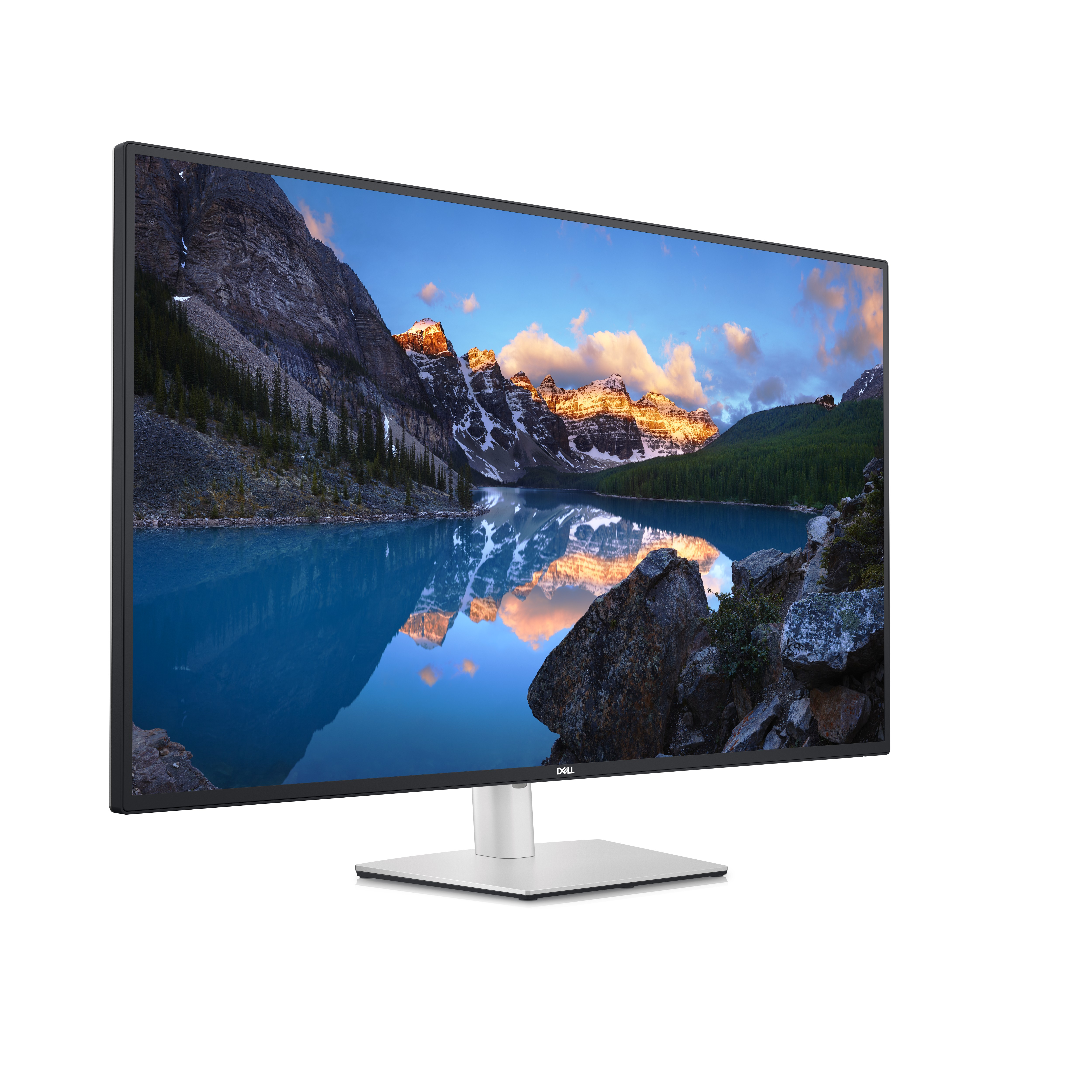 Dell-Monitor zeigt eine Berglandschaft mit See. Der Monitor steht auf einem silbernen Ständer, weißer Hintergrund.