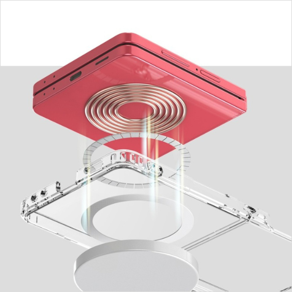 Czerwony telefon znajduje się nad przezroczystym etui. Telefon ma miedzianą cewkę. Pod etui znajduje się biały dysk.