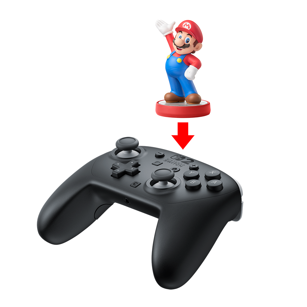 Siyah Nintendo Switch kontrolcüsünün üzerinde Mario figürü. Kırmızı bir ok, figürden kontrolcüye doğru işaret ediyor.