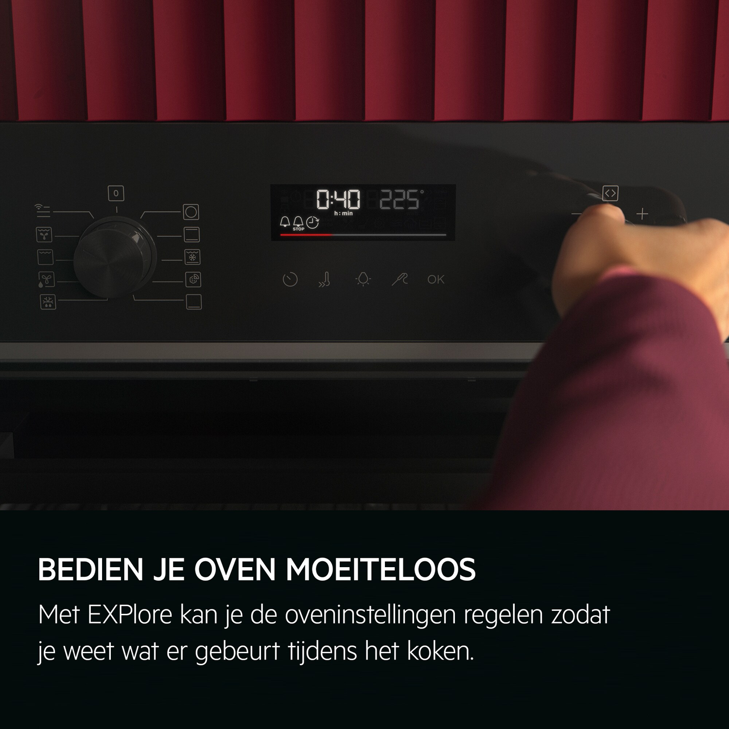 A hand adjusts an oven control panel displaying time and temperature. The panel has dials and buttons, with a red background.