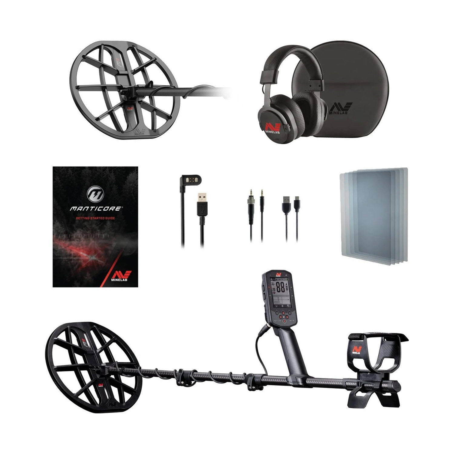 Kit metal detector. Include rilevatore, cuffie, manuale, cavi e custodia. Tutti gli elementi sono neri e grigi, con dettagli rossi.