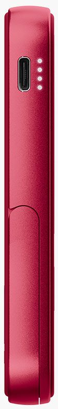 Un appareil rouge et rectangulaire est vertical. Il possède un port de charge et quatre petits points lumineux indiquant le niveau de la batterie.