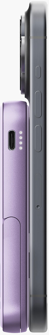 Une batterie externe violette à côté d'un téléphone gris foncé. La batterie a un port USB et des voyants.