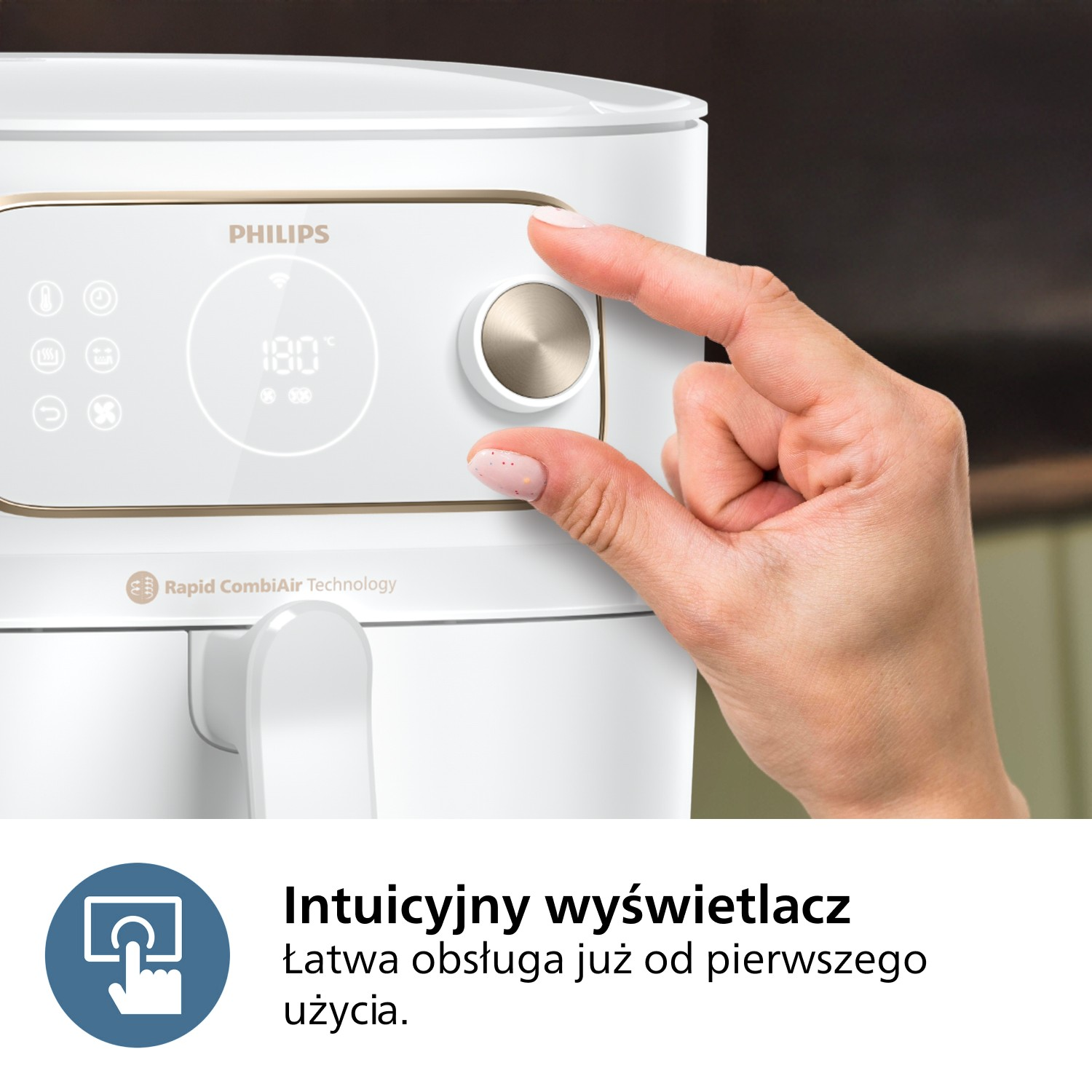 Biała frytkownica Philips. Ręka obraca pokrętło. Wyświetlacz pokazuje 180 stopni. Tekst mówi 'Intuicyjny wyświetlacz'.