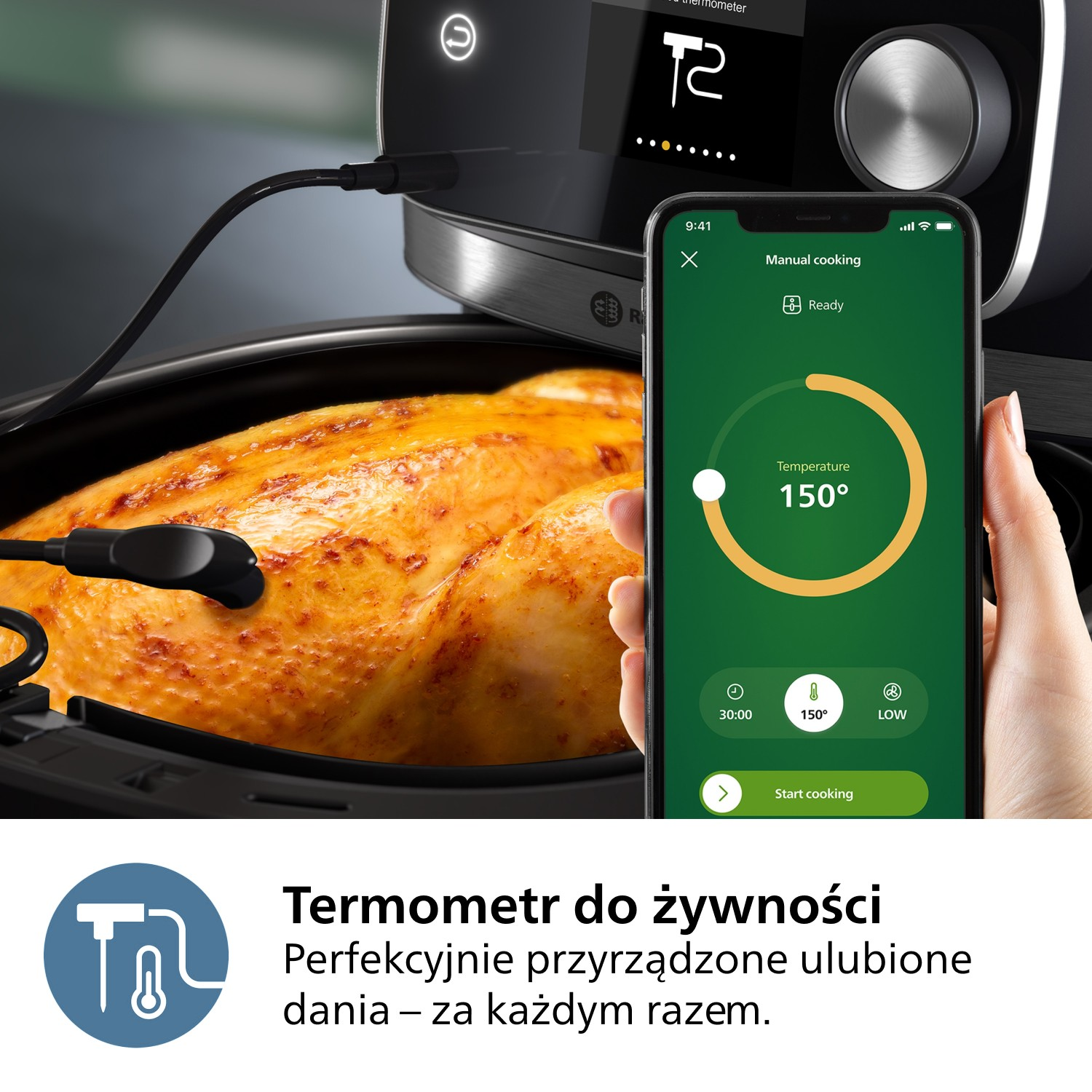 Pieczony kurczak w czarnej frytkownicy powietrznej, ze smartfonem pokazującym 150 stopni. Termometr włożony w kurczaka.