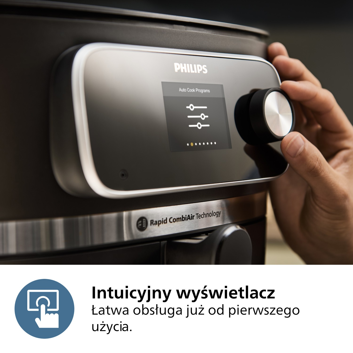 Ręka obraca pokrętło na urządzeniu Philips. Ekran wyświetla 'Auto Cook Programs'. Urządzenie ma 'Rapid CombiAir Technology'.