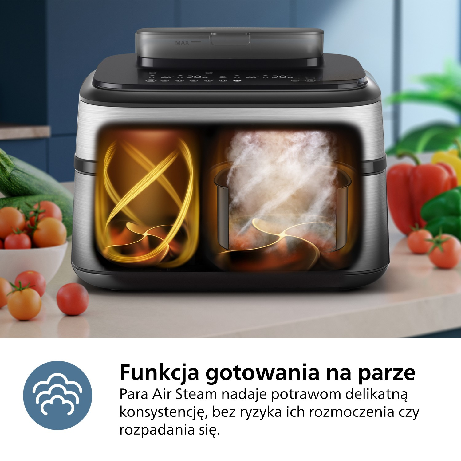 Srebrne i czarne urządzenie z dwiema komorami. Jedna pokazuje złote wiry, druga parę. Warzywa i pomidory w tle.