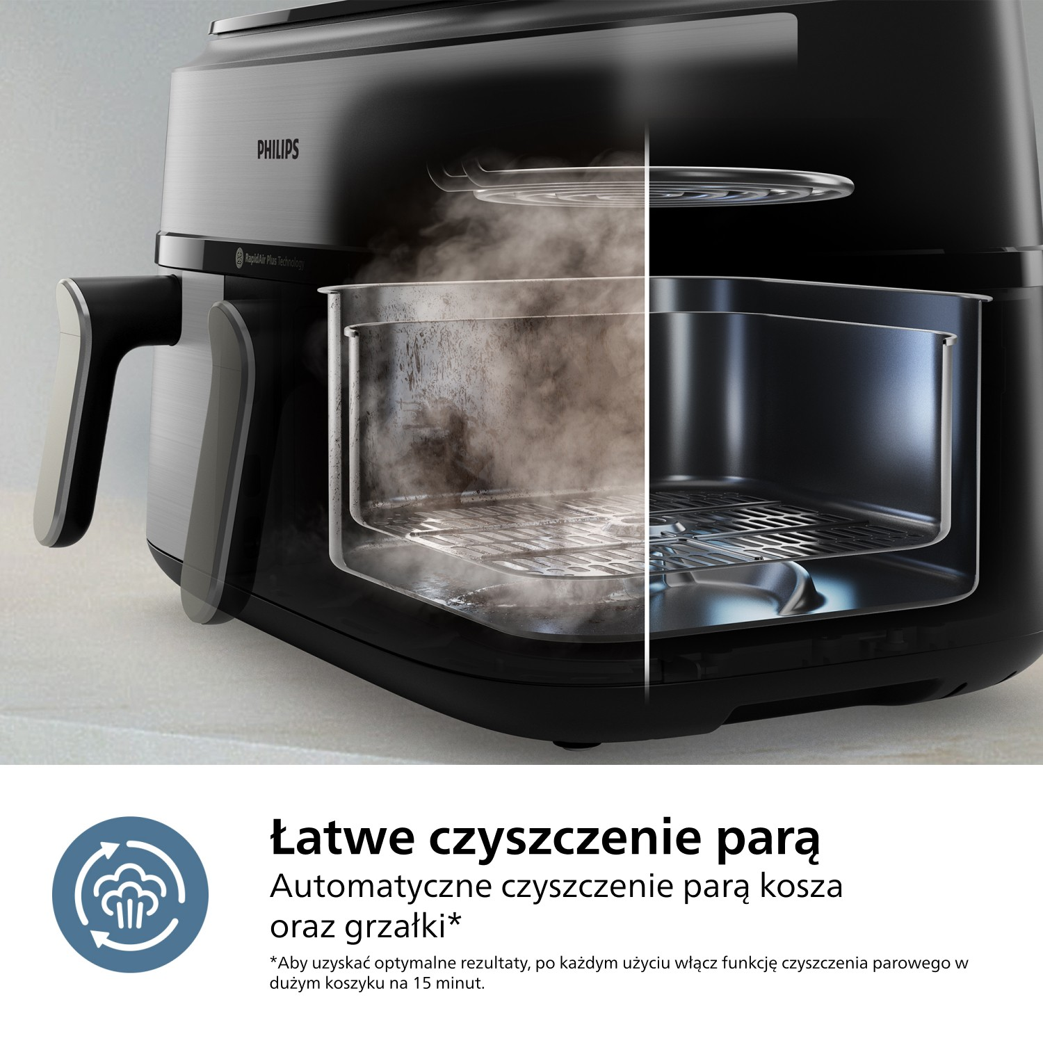Pokazano czarną frytkownicę Philips, przeciętą na pół, aby odsłonić wnętrze. Para jest widoczna. Tekst wspomina o łatwym czyszczeniu parą.