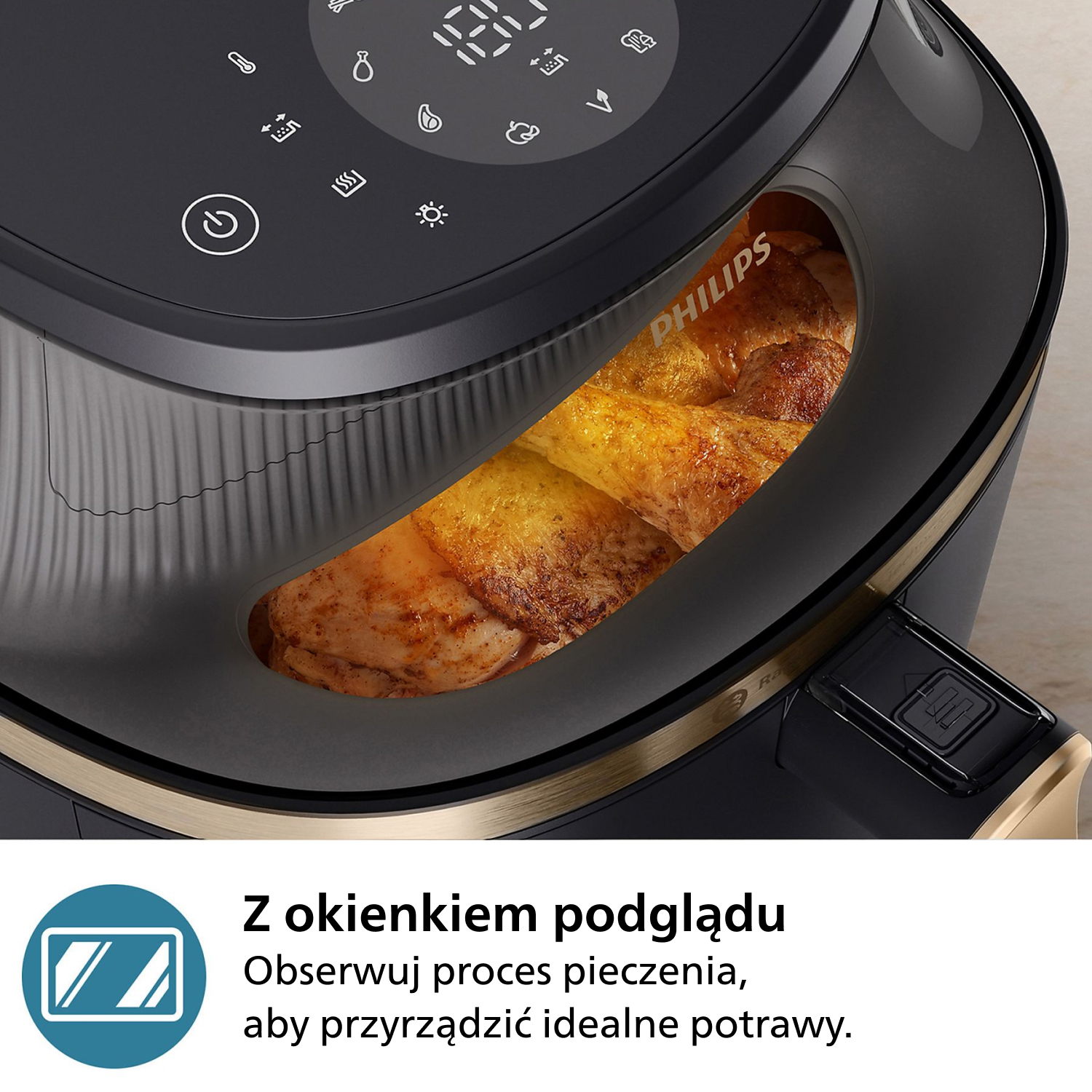 Czarna frytkownica Philips z oknem pokazującym pieczonego kurczaka. Panel sterowania u góry; złote akcenty. Tekst po polsku na dole.