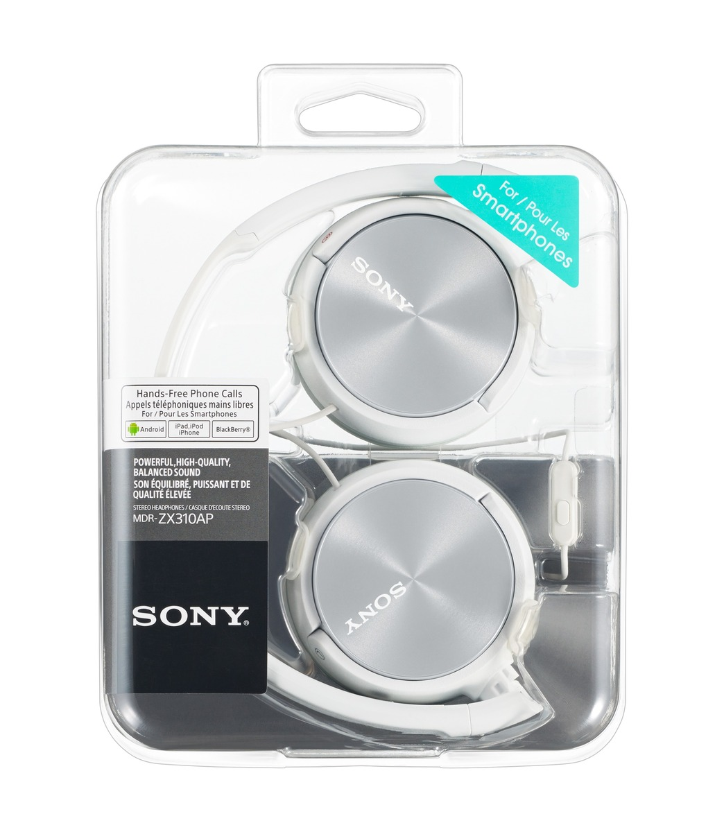 White Sony headphones in a clear plastic package. Silver earcups and white headband. Text labels indicate features and compatibility.
