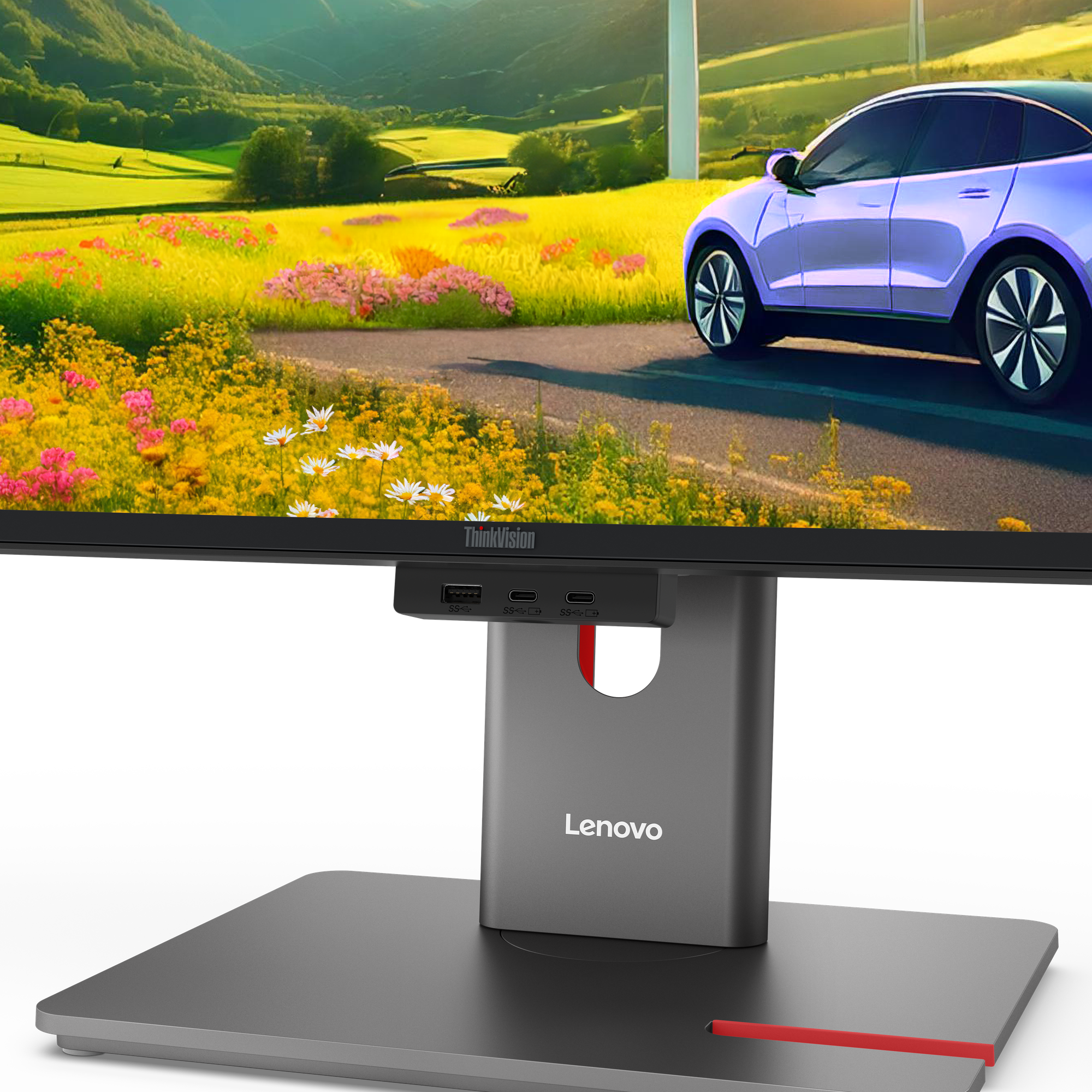 Ein Lenovo-Monitor zeigt ein Blumenfeld mit einem Auto auf einer Straße. Der Monitor hat einen schwarzen Rahmen und einen grauen Ständer.