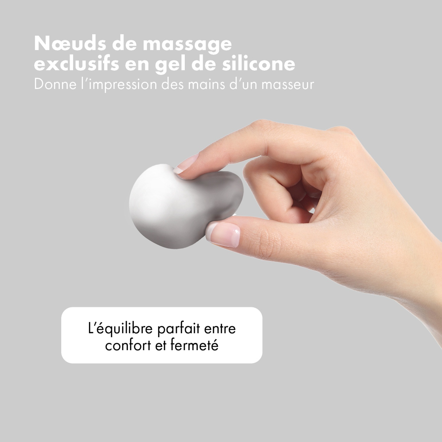 Une main tient une boule de massage en silicone blanche. Texte: Nœuds de massage en gel de silicone exclusifs. Équilibre parfait entre confort et fermeté.