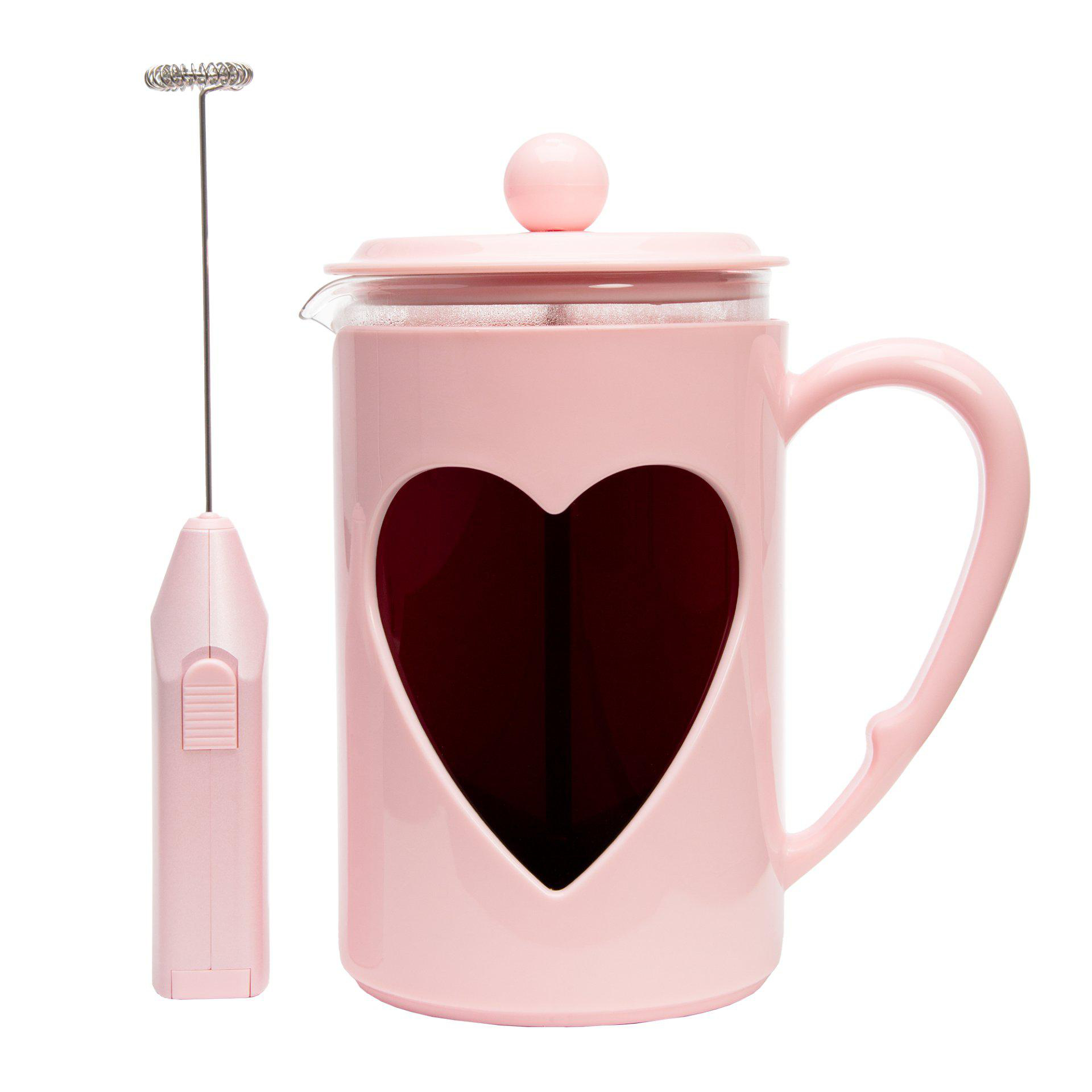 Rosa French Press mit Herz-Ausschnitt und einem Milchaufschäumer. Weißer Hintergrund.