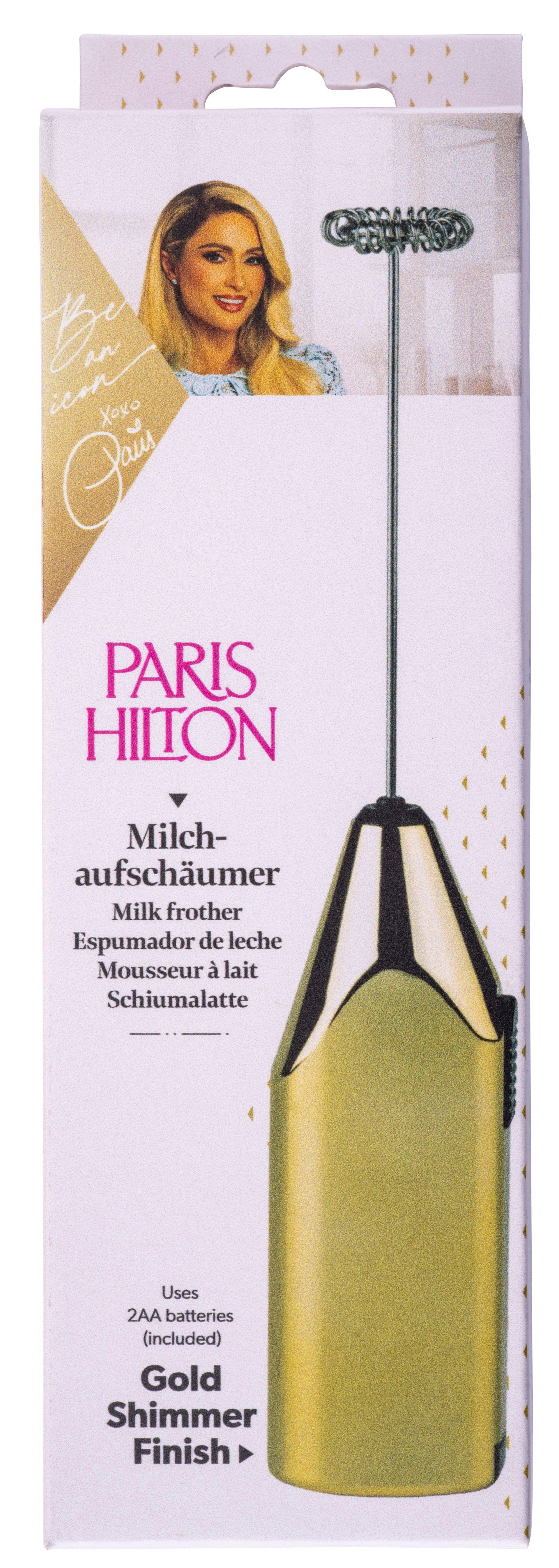 Schachtel für Paris Hilton Milchaufschäumer. Sie hat ein Bild von Paris Hilton und den Produktnamen. Goldfarbener Aufschäumer sichtbar.