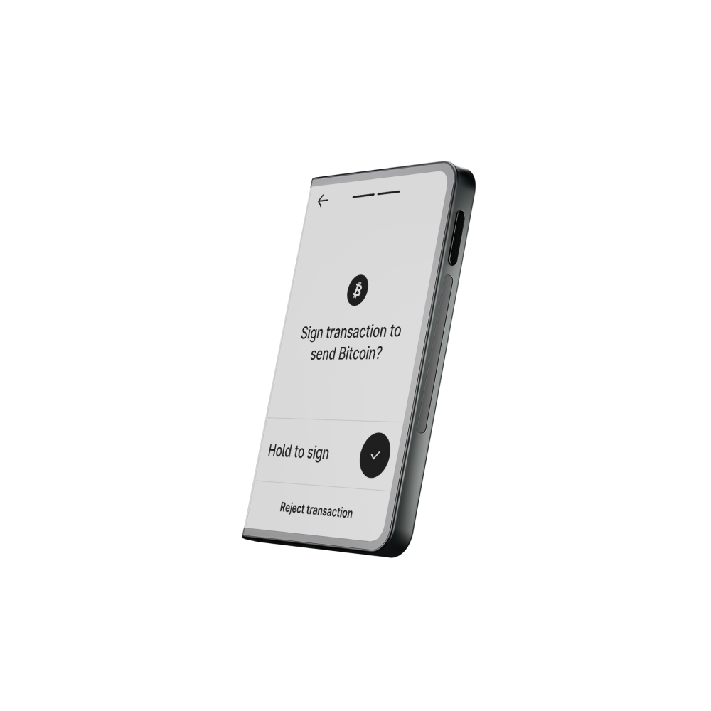 Un teléfono muestra una transacción de Bitcoin. Pregunta si se firma para enviar Bitcoin, con opciones de mantener para firmar y rechazar.