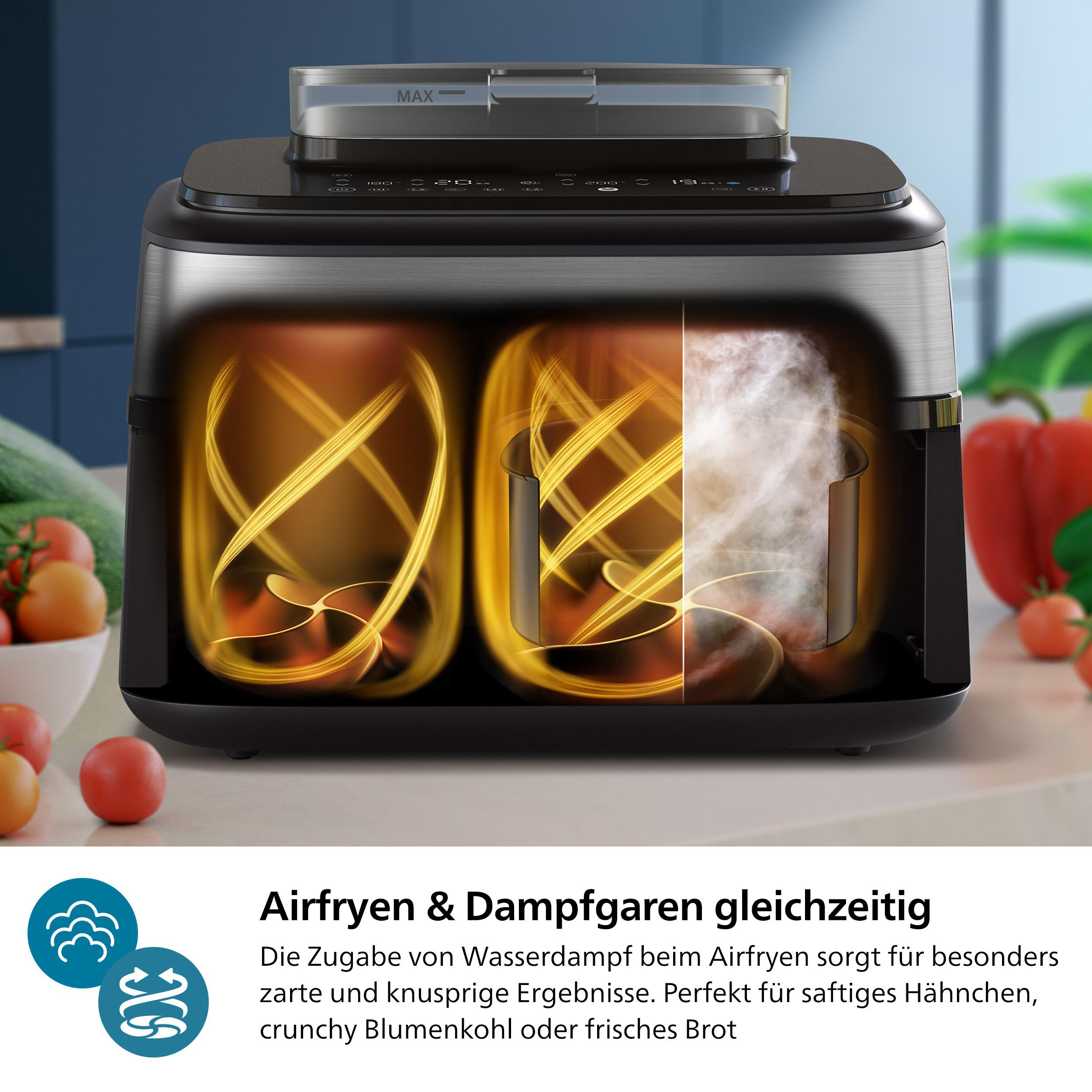Ein Airfryer mit zwei Fächern, eines mit Dampf und das andere mit Luft. Gemüse ist im Vordergrund.