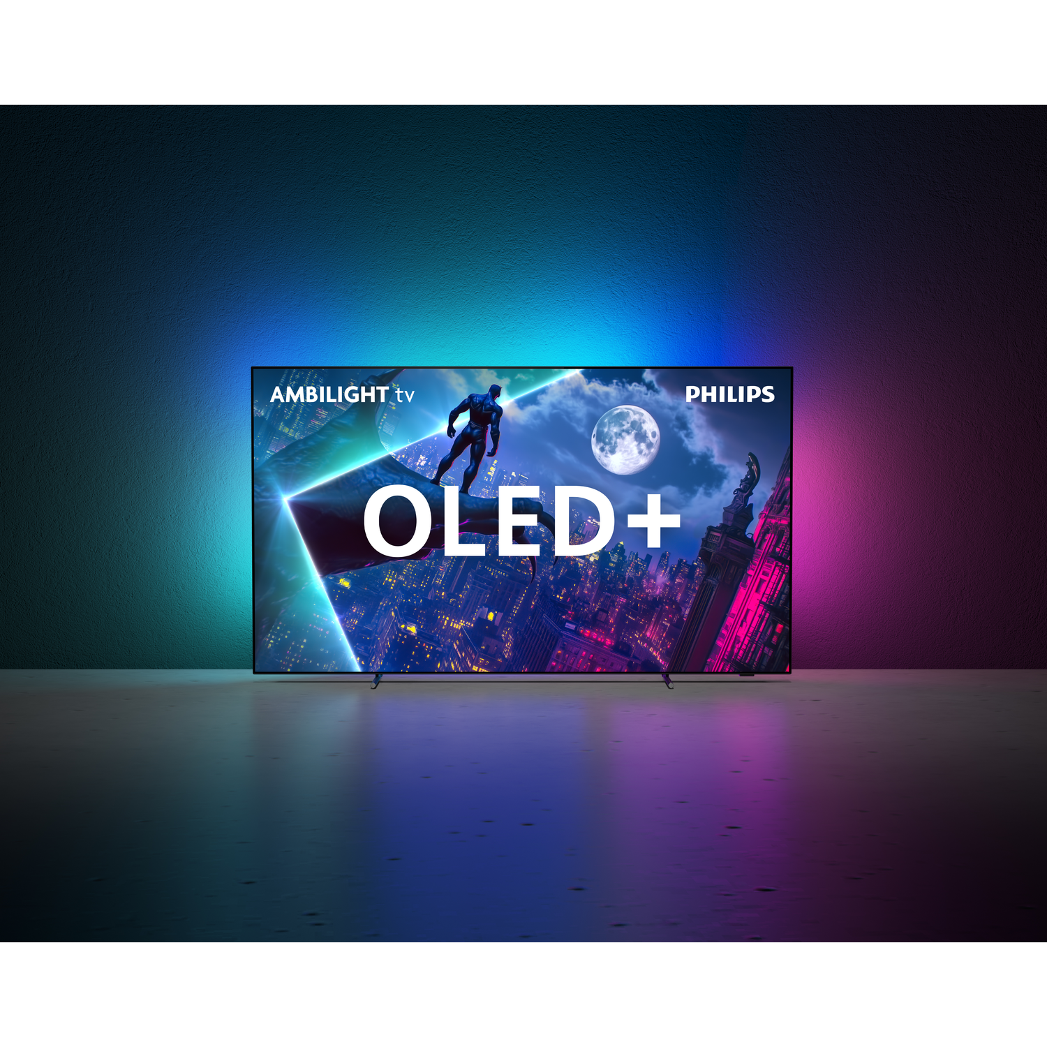 A Philips OLED+ TV displays a cityscape with a superhero silhouette under a full moon. The TV has Ambilight and OLED+ written on it.
