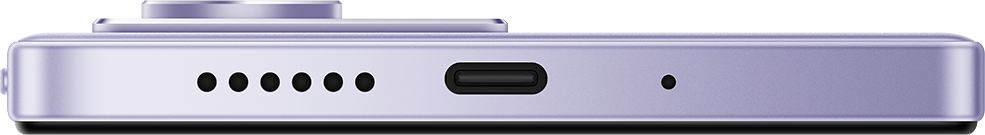 A lila okostelefon alsó szélének közeli képe. USB-C porttal, hangszóró lyukakkal és mikrofonnal rendelkezik.